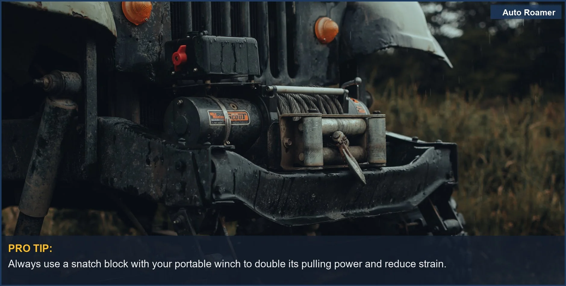 Detailed view of an off-road bumper with a metal tow winch, ready for car camping adventures.