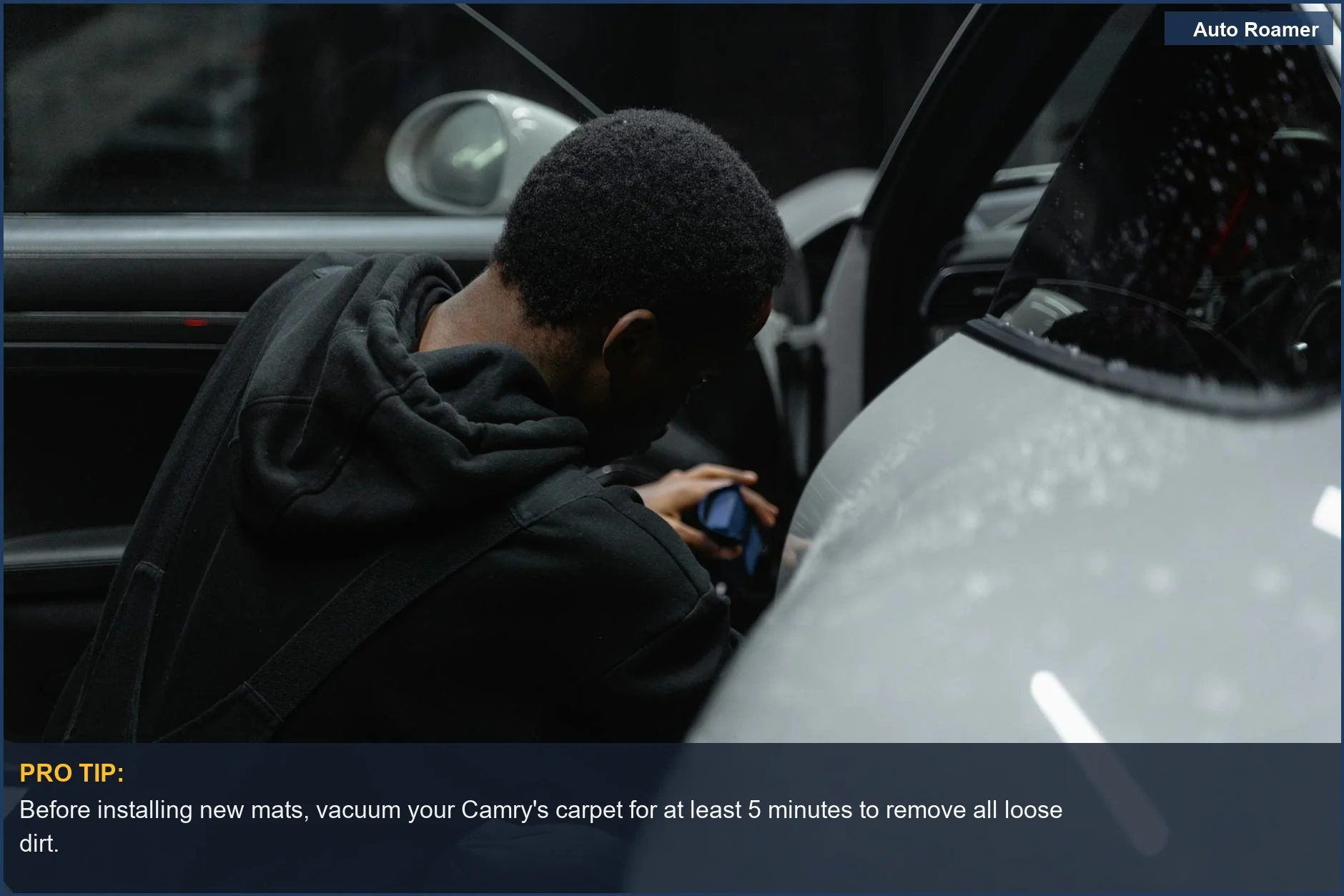 Meticulous car detailing under dim light, showcasing the care needed for your Toyota Camry's interior.