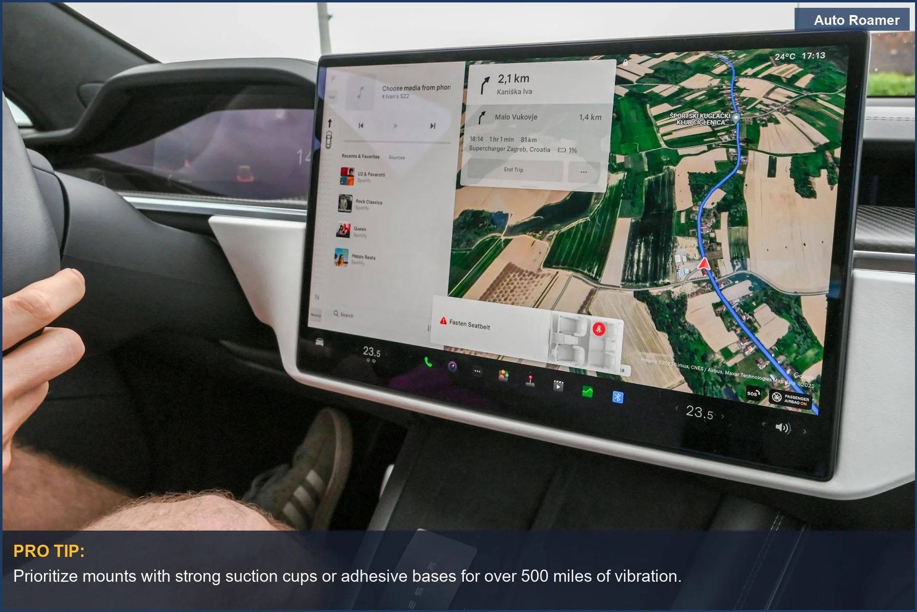 Driver uses a car's built-in navigation screen with a detailed digital map during a trip.