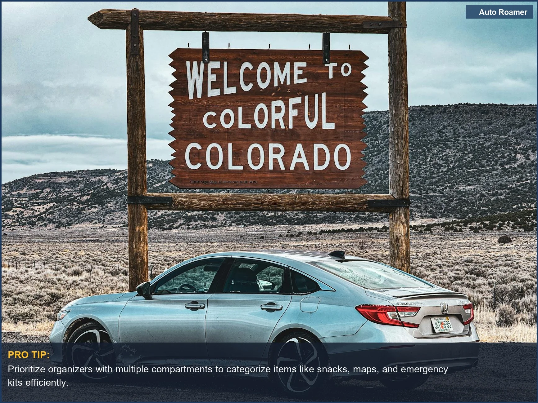 Silver sedan at Colorado welcome sign, ideal for organizing car trunk essentials.