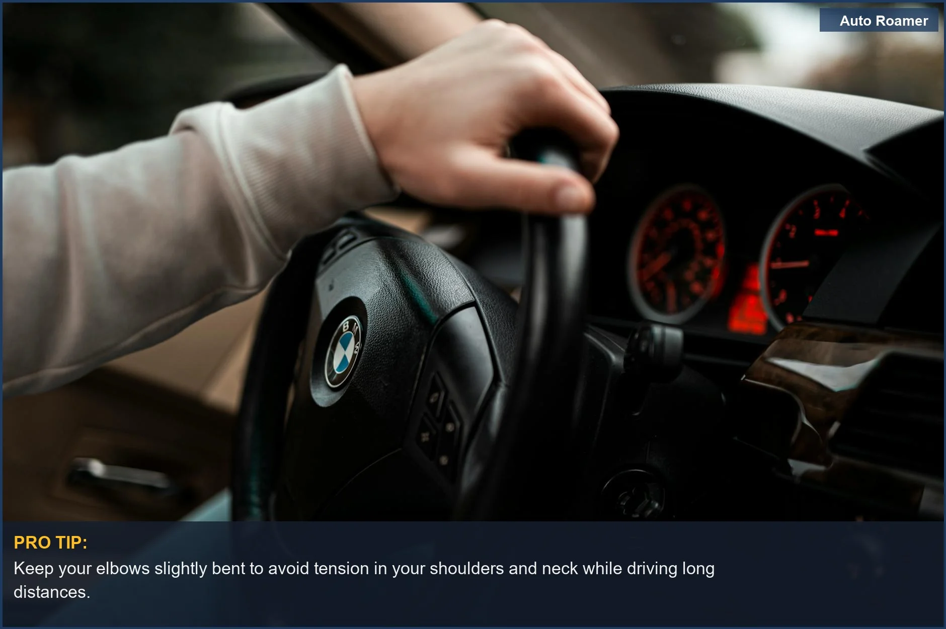 Close-up of hand gripping steering wheel, showing dashboard for a safe and comfortable driving posture on long road trips.