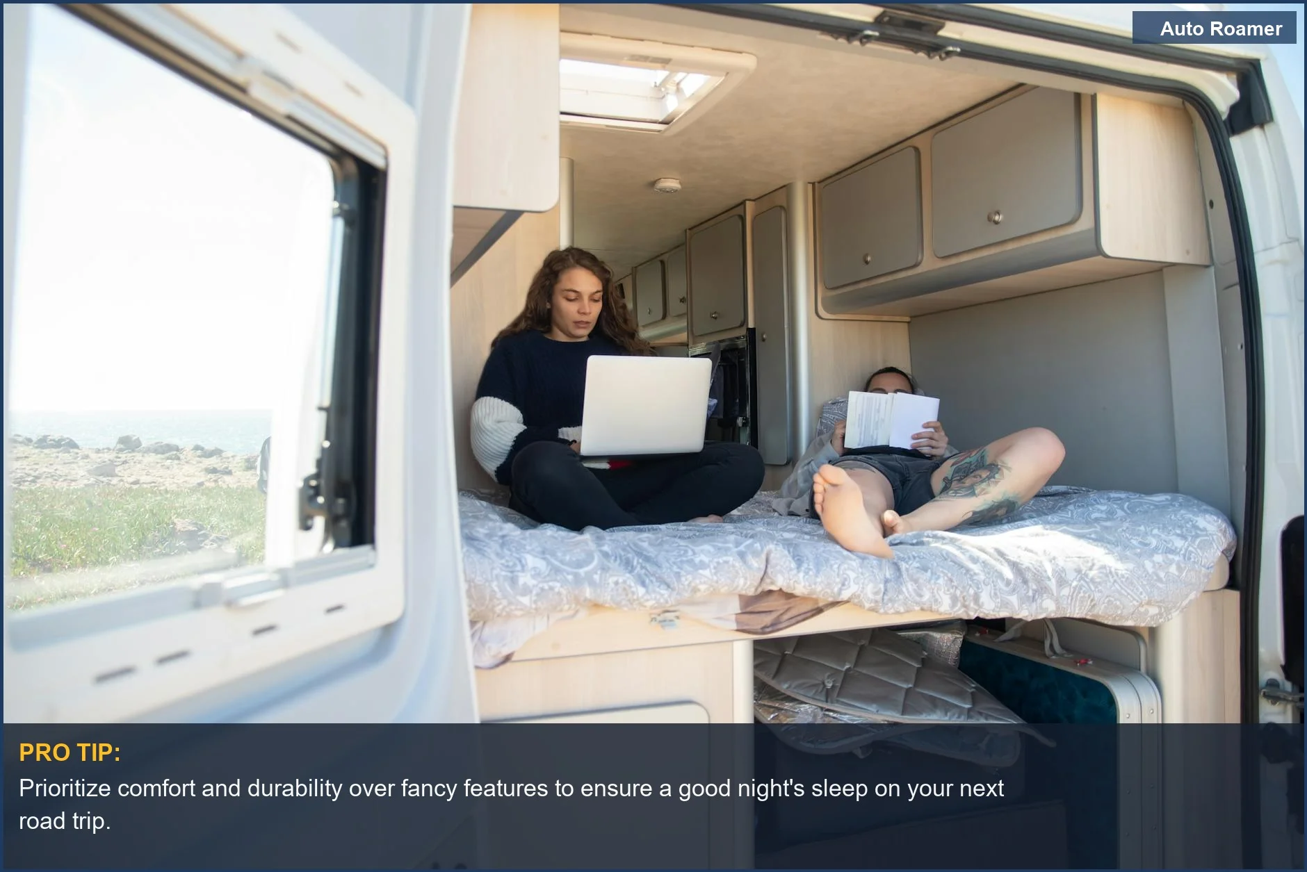 Couple relaxing in a motorhome, highlighting comfortable road trip sleeping solutions with an inflatable car bed.