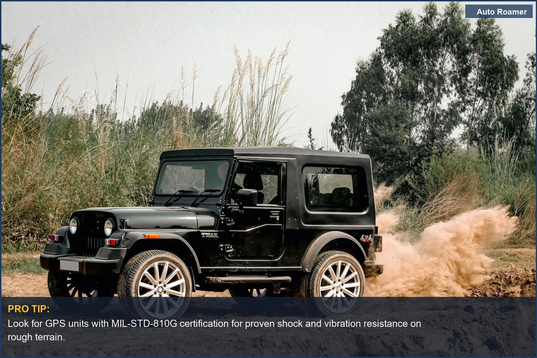 Black Mahindra Thar SUV kicking up dust during an extreme off-road GPS system test.