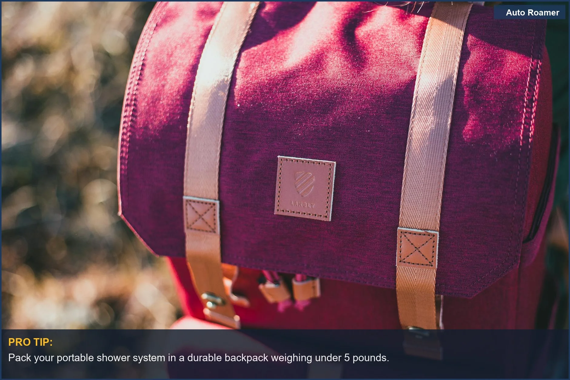 Stylish red backpack in a natural outdoor setting, ideal for carrying camping shower essentials.