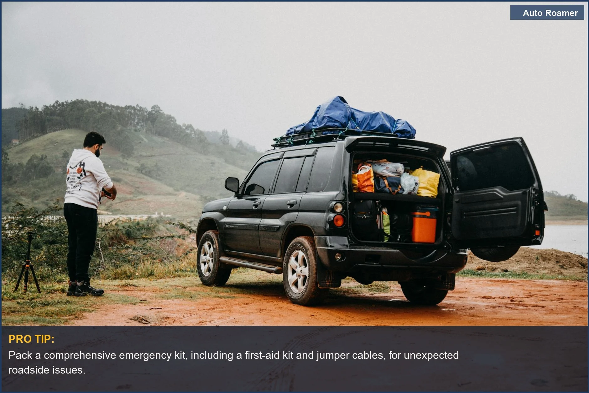 Man packs SUV for foggy countryside road trip, highlighting essential travel gear for comfort and safety.