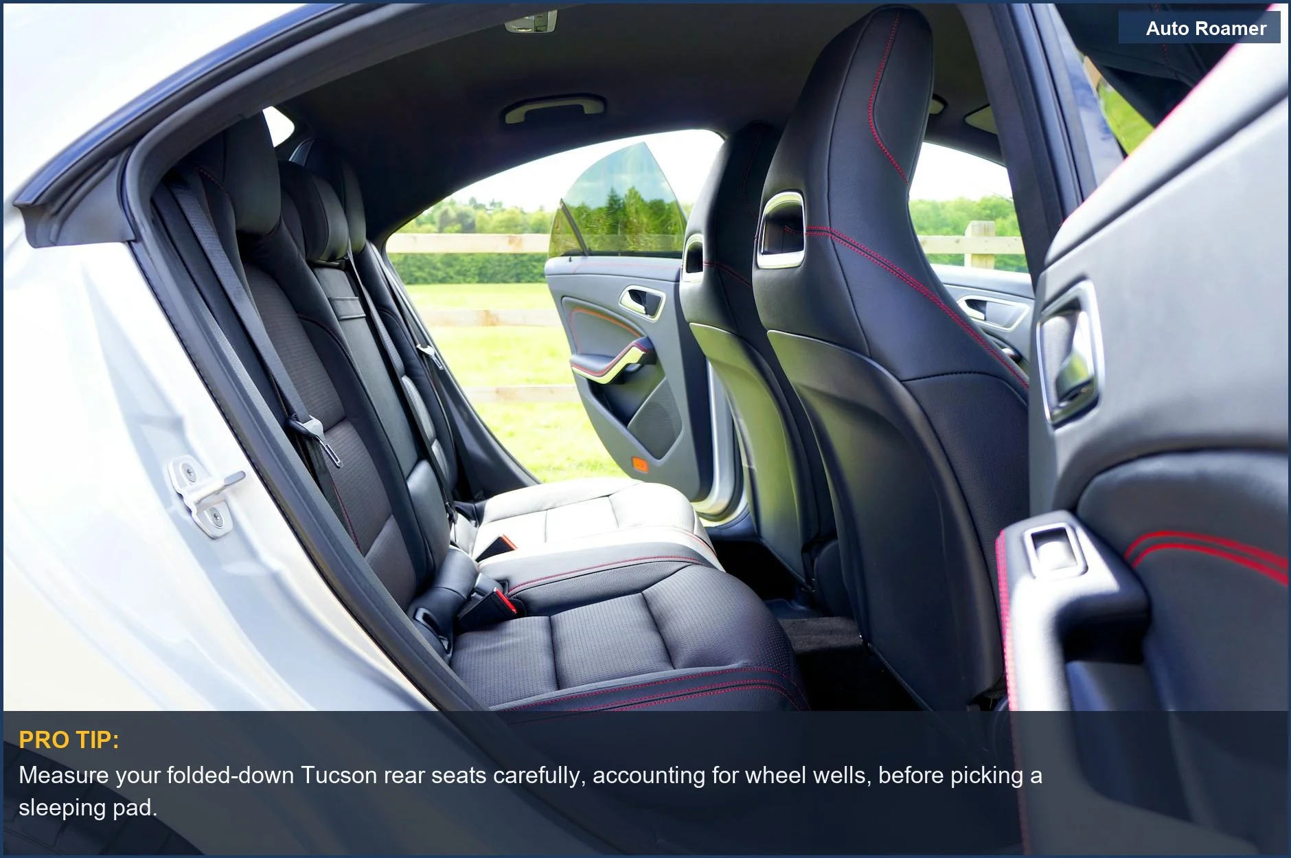 Hyundai Tucson interior with rear doors open, highlighting the sleeping platform space for camping.