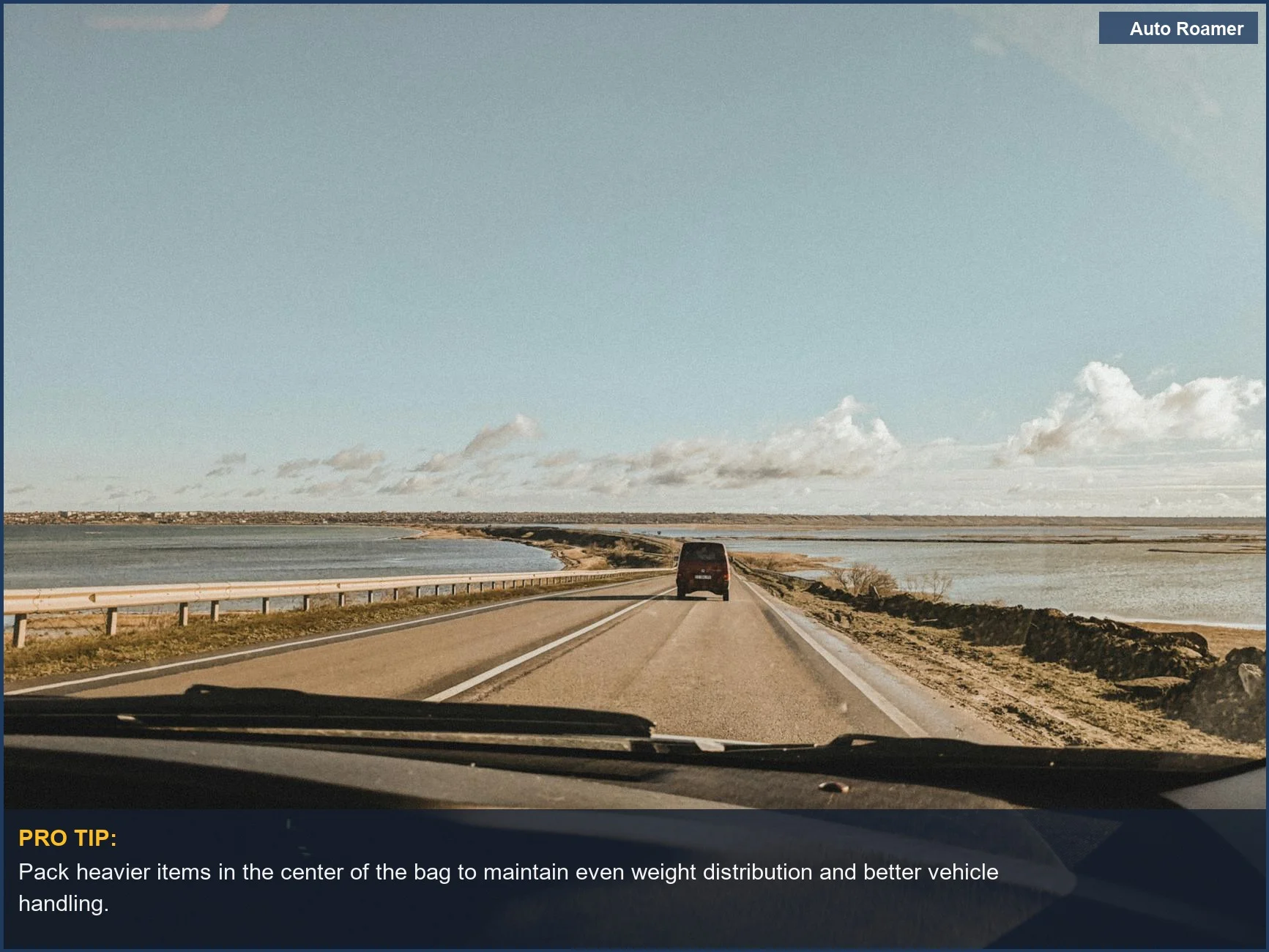 Serene coastal drive with open skies and tranquil waters, illustrating a peaceful road trip experience.