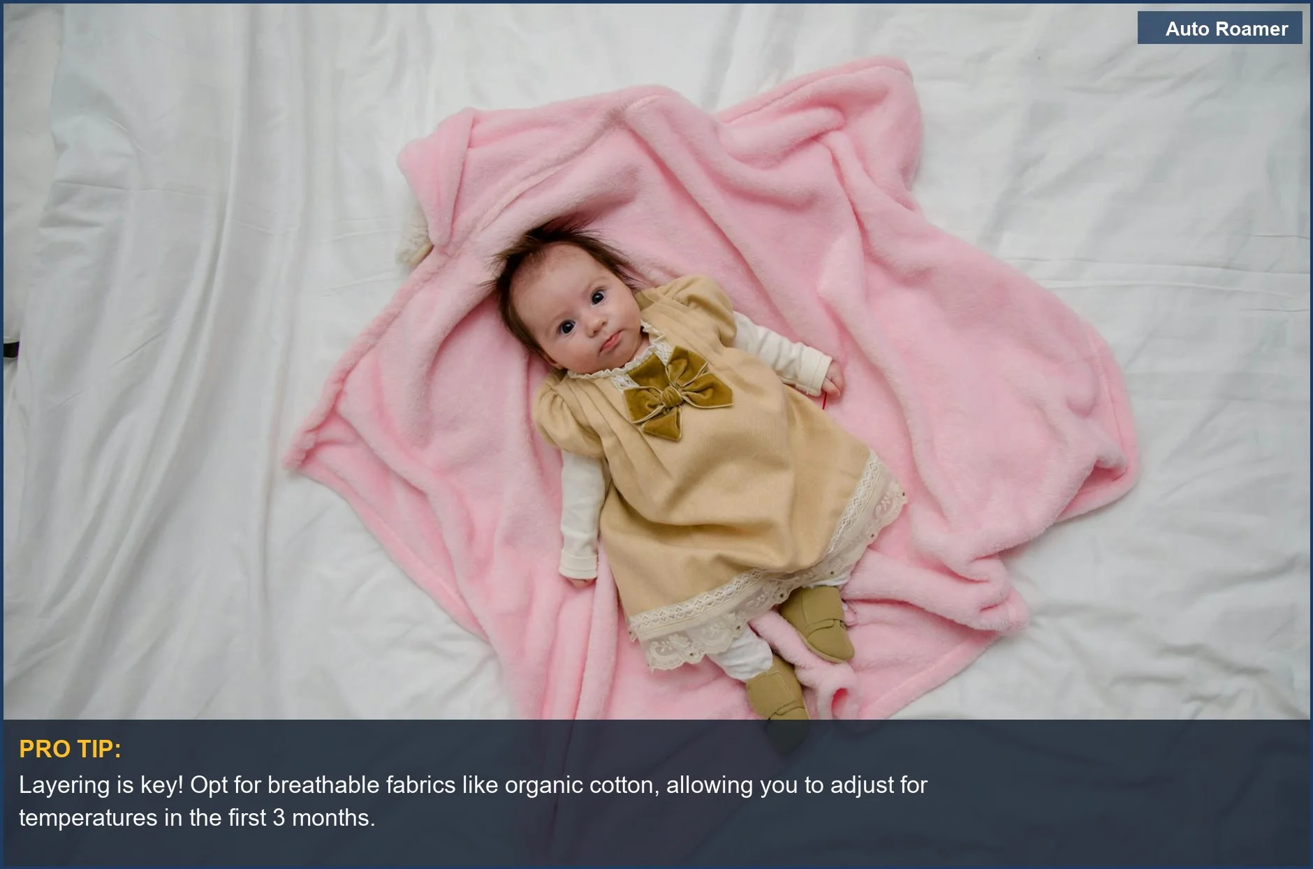 Sweet baby girl in a charming dress on a pink blanket, ideal for lightweight baby travel outfits.