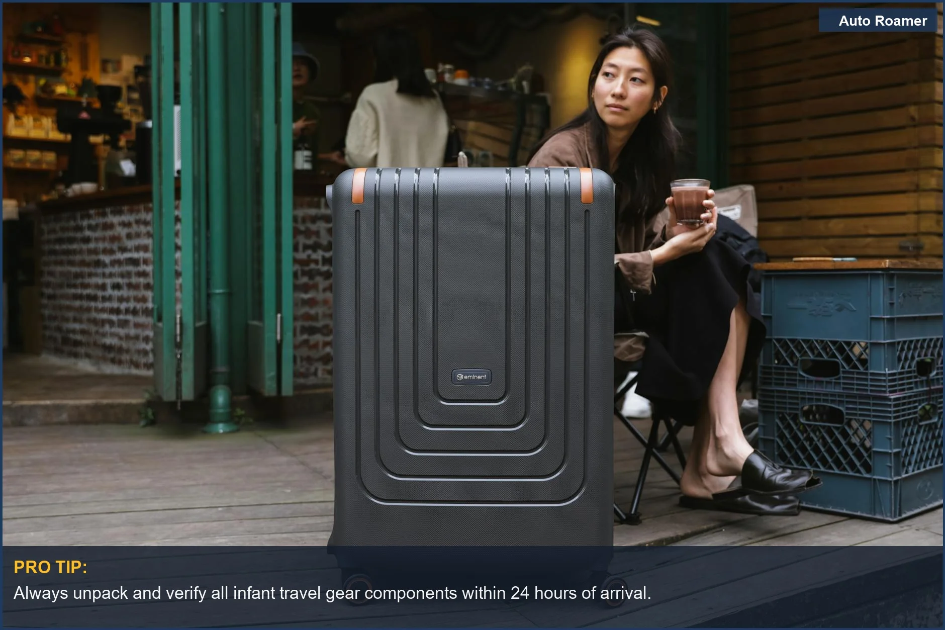 Asian woman at a cafe with a suitcase, preparing for travel with her infant and essential gear.