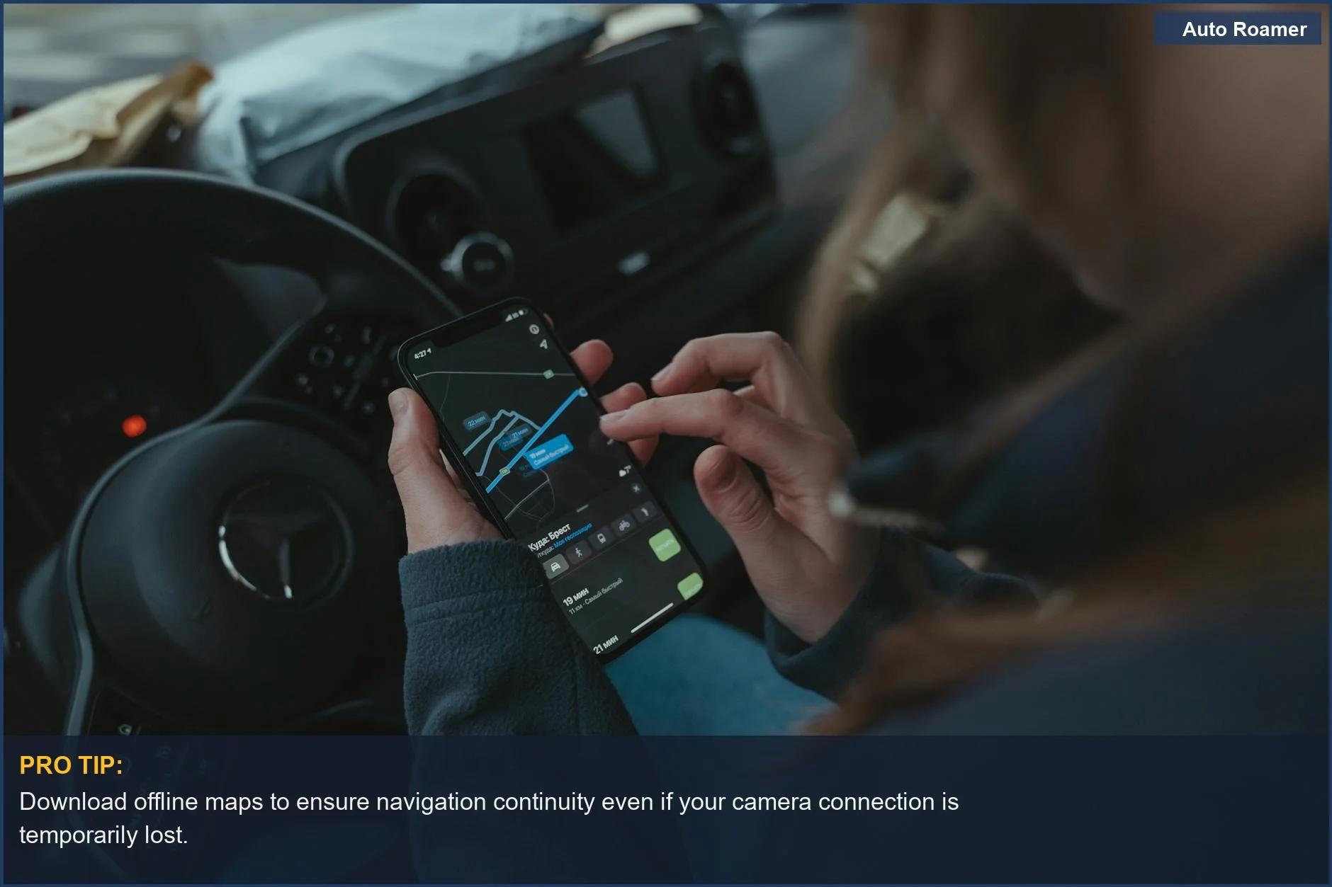 Person using GPS navigation app on smartphone inside car, demonstrating phone integration.