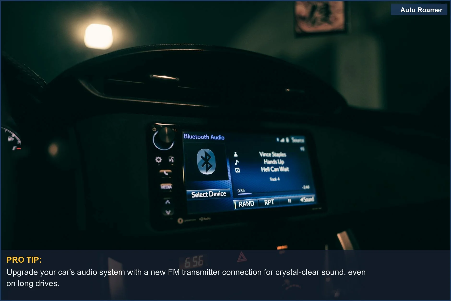Nighttime view of a car dashboard with a glowing Bluetooth audio system, emphasizing the FM transmitter connection.