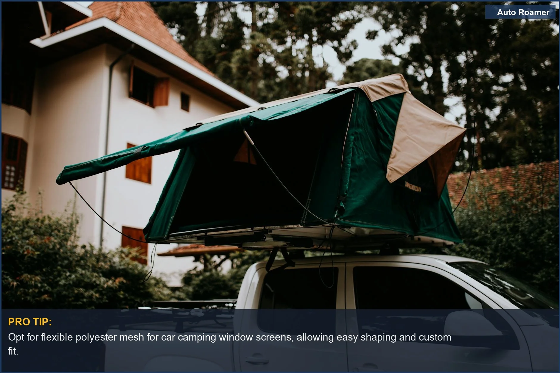 Rooftop camping tent on a pickup truck, demonstrating flexible bug net material for windows.