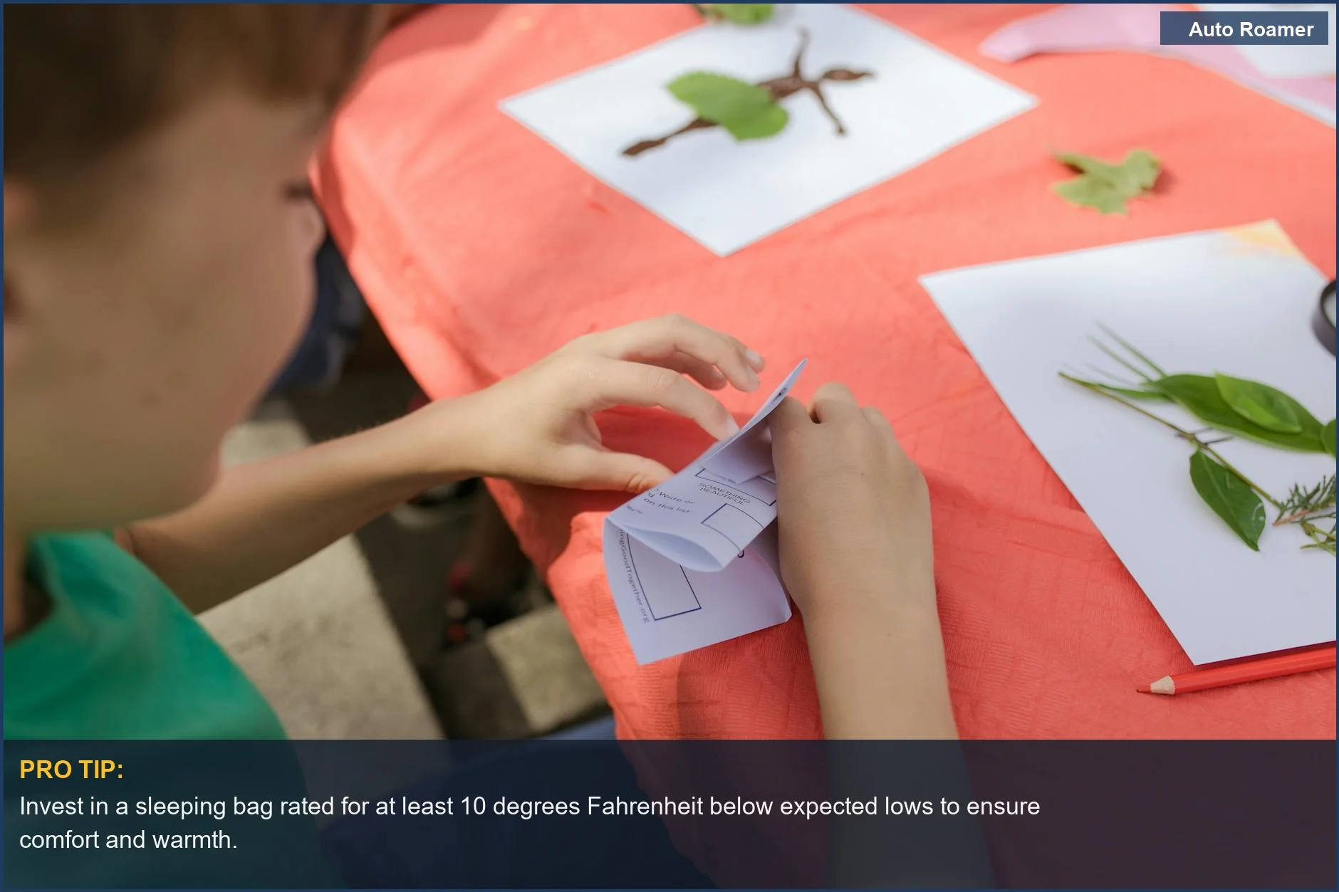 Young child happily creating a nature craft using leaves during an outdoor camp activity, a fun learning experience.