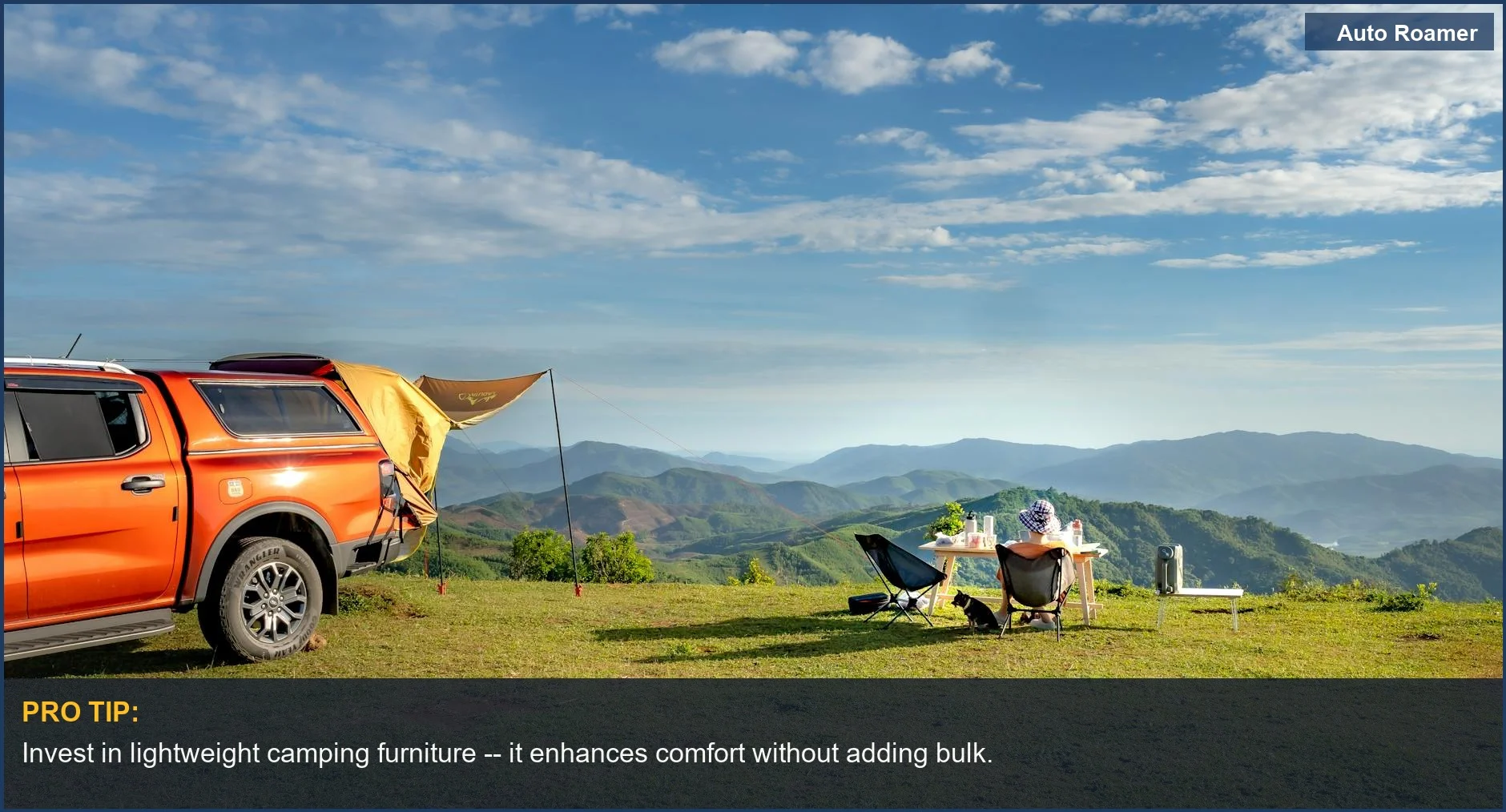 Orange pick-up truck with chairs and table on hilltop for a functional camping setup for Ram 1500.