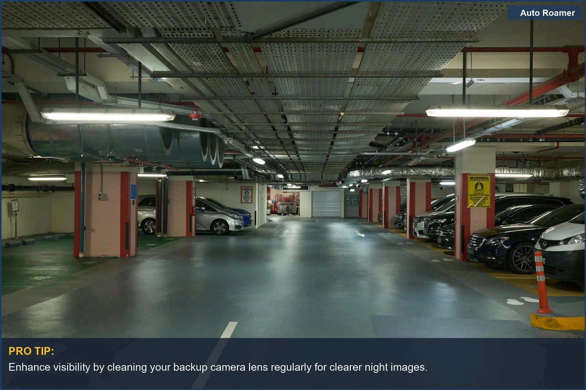 Dimly lit underground parking garage with modern cars, enhancing backup camera at night visibility.