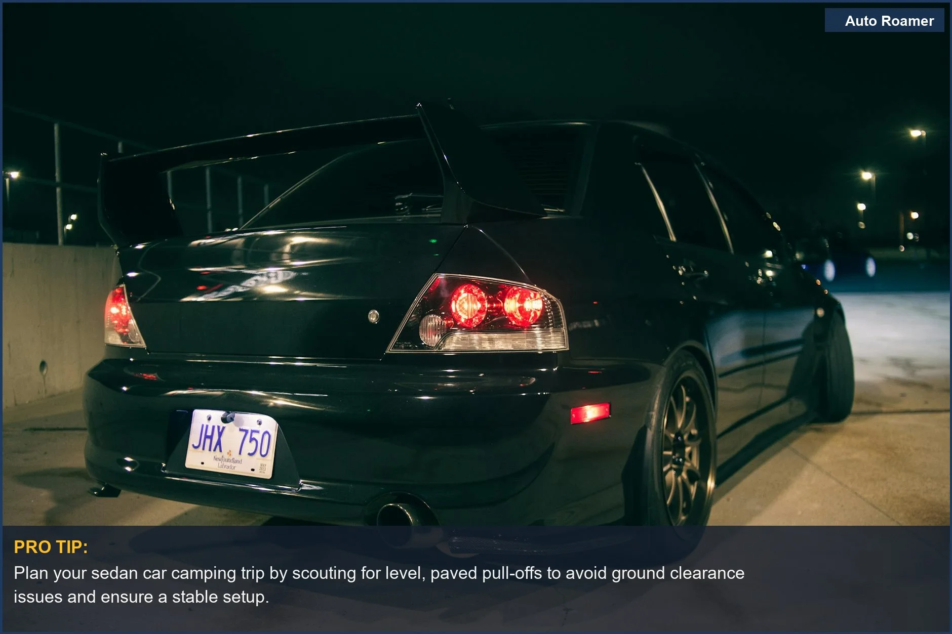 Sporty Mitsubishi Lancer Evolution parked at night, illustrating a compact car's adventure capabilities for camping.