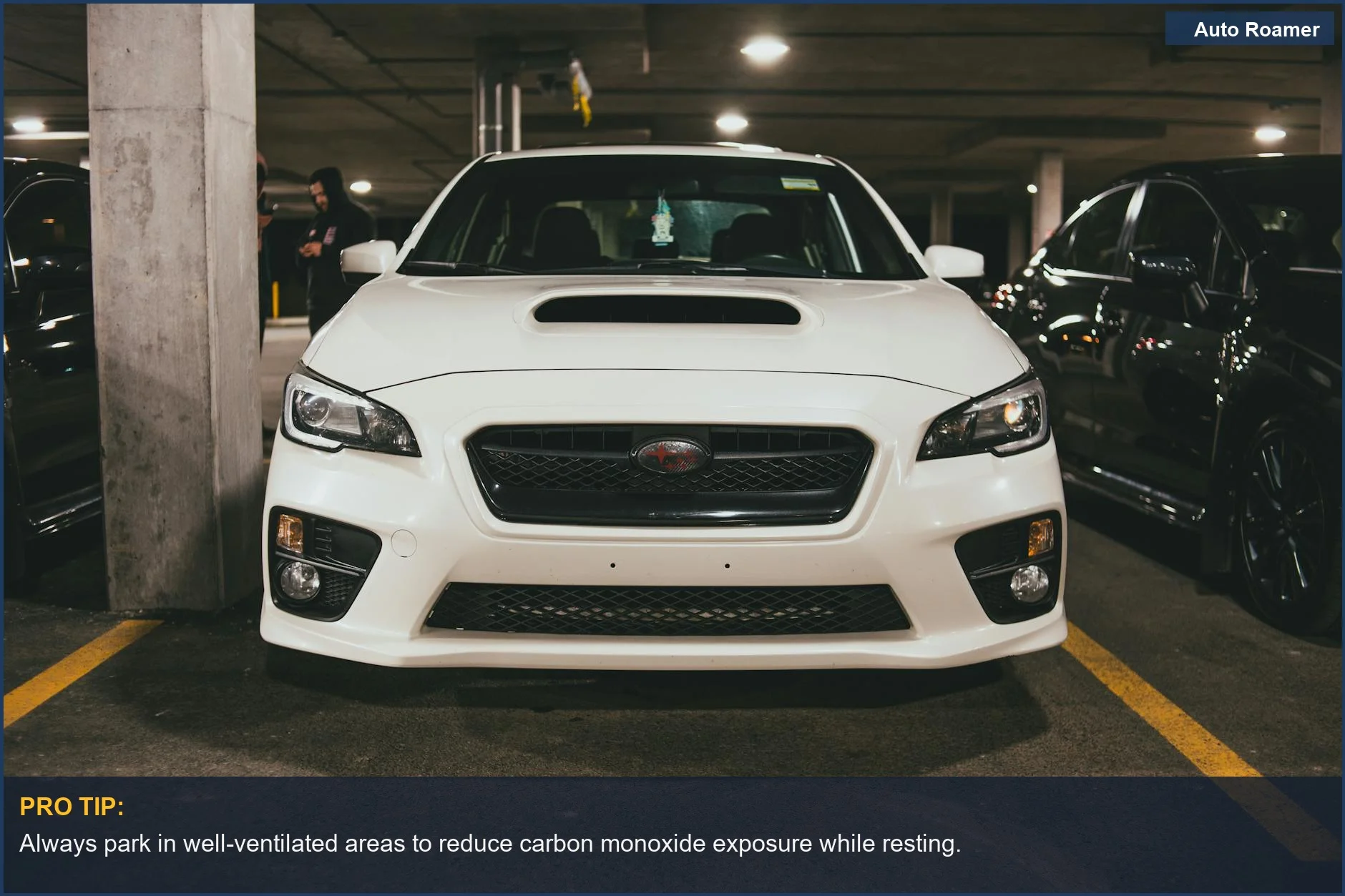 Front view of a white car in an urban garage, highlighting carbon monoxide poisoning risk while sleeping inside.