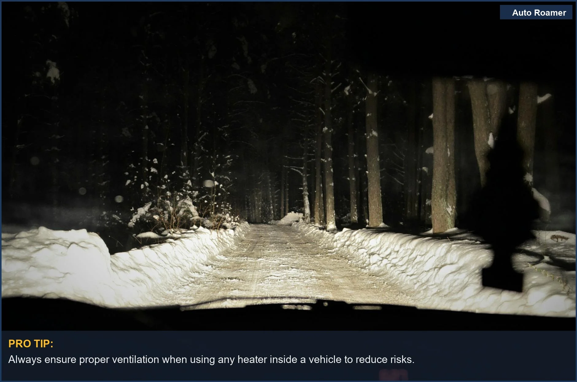 Night view from a car interior of a snowy road lit by headlights, raising questions about portable heater use.