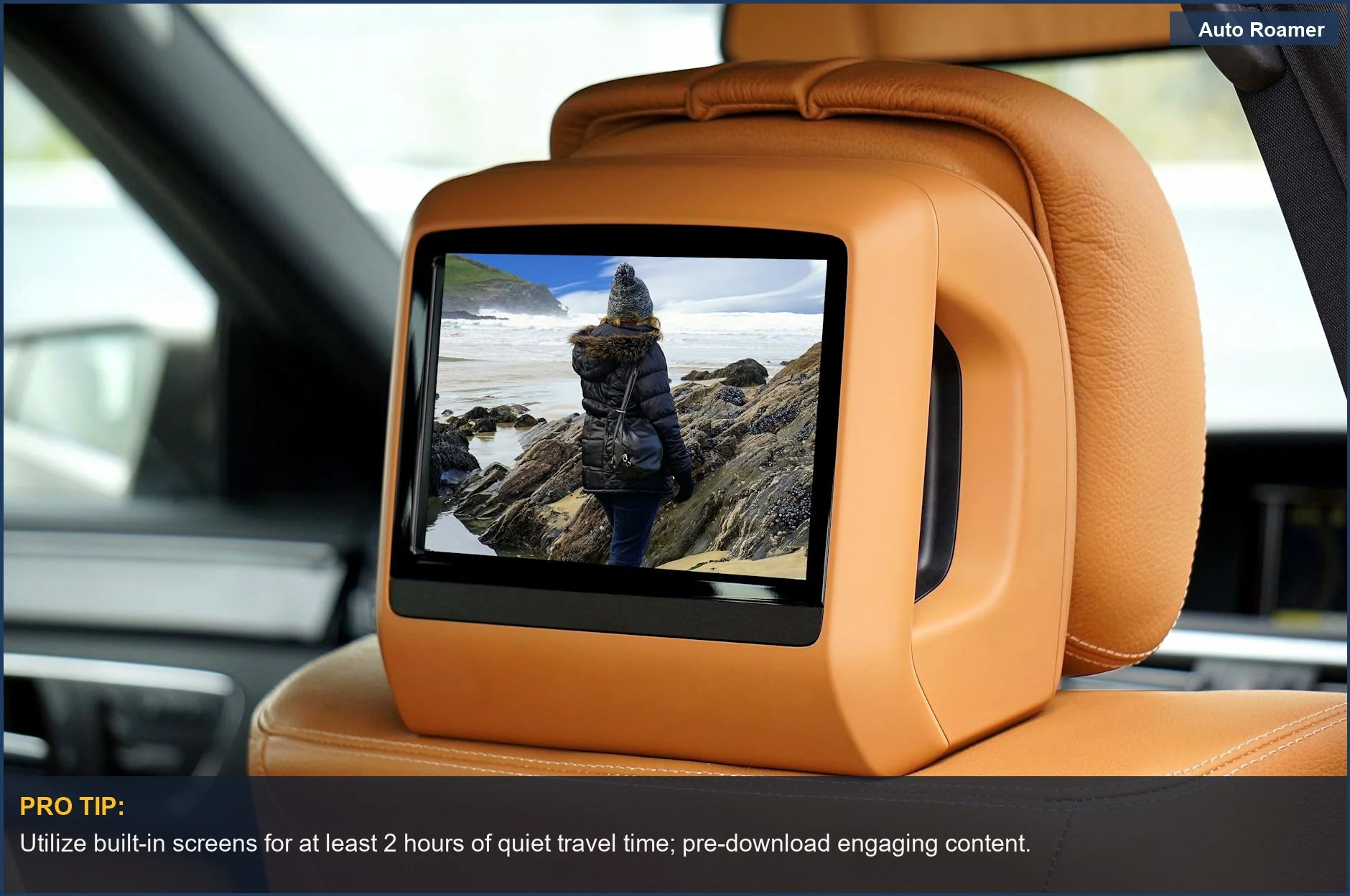 Luxury car interior with built-in screen showing scenic views for ultimate kid entertainment on road trips.