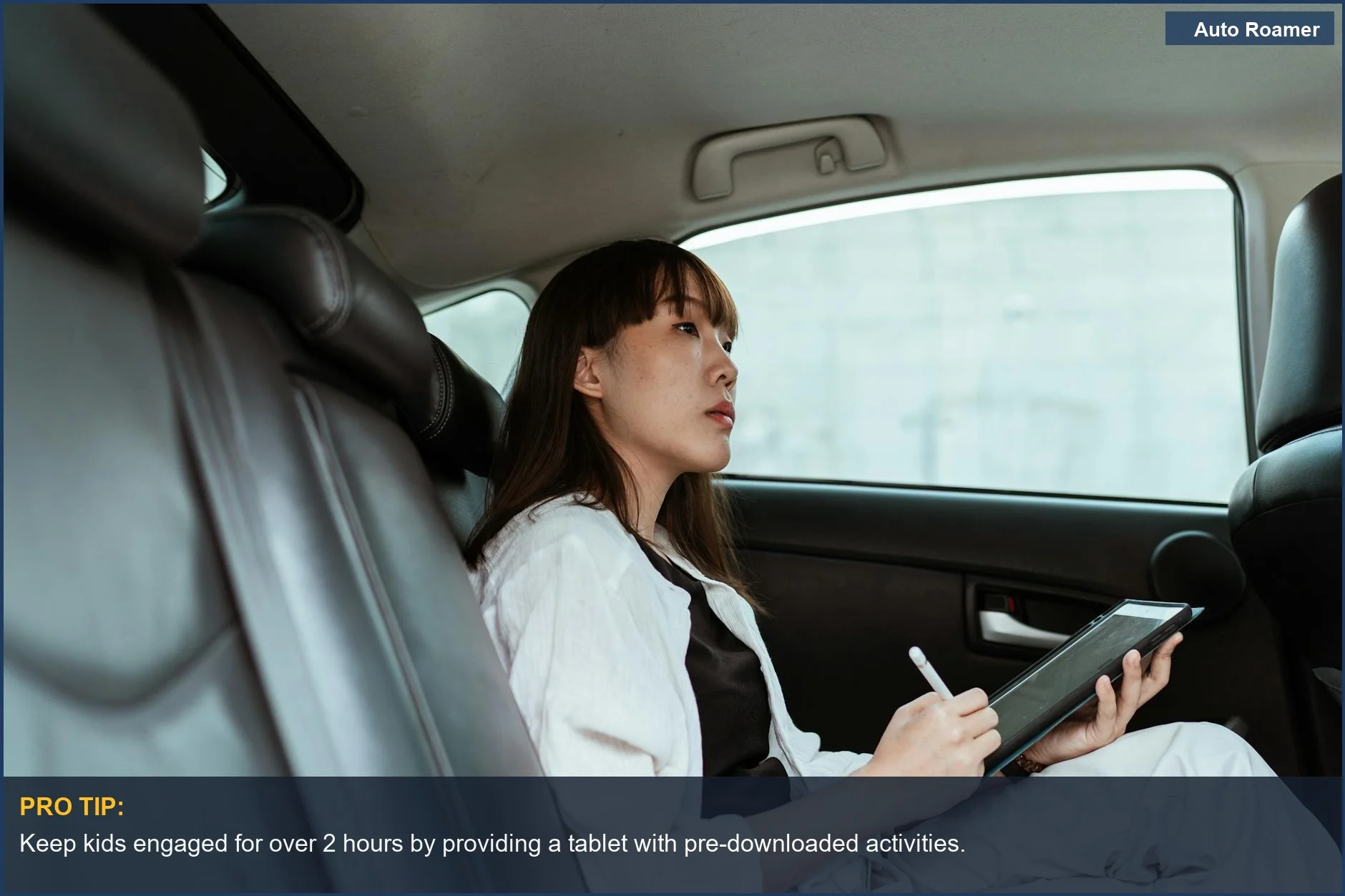 Mom uses a tablet as a car accessory for road trips with kids to stay organized and entertained.