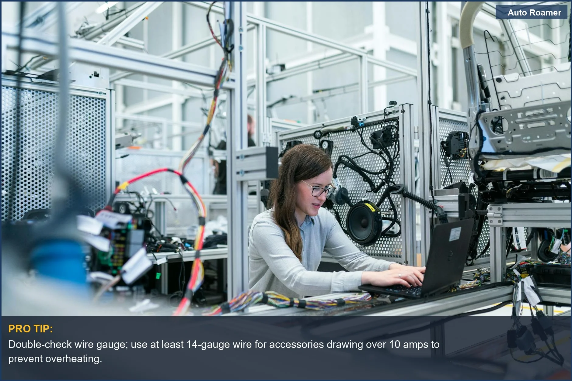 Female engineer analyzing electrical schematics on a laptop, illustrating car accessory installation mistakes leading to electrical failure.