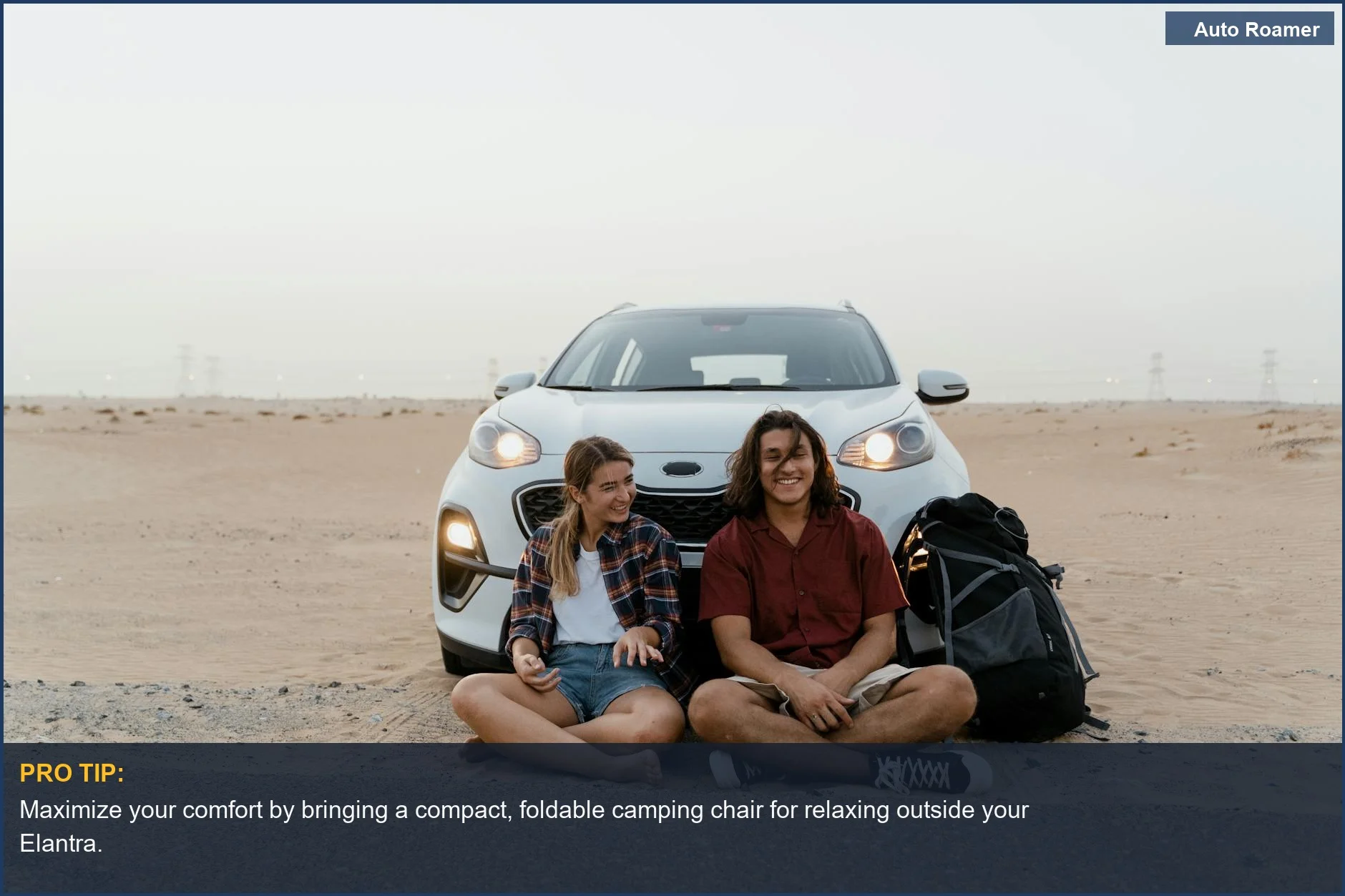 Couple car camping in a Hyundai Elantra GT, enjoying the desert scenery on a road trip.