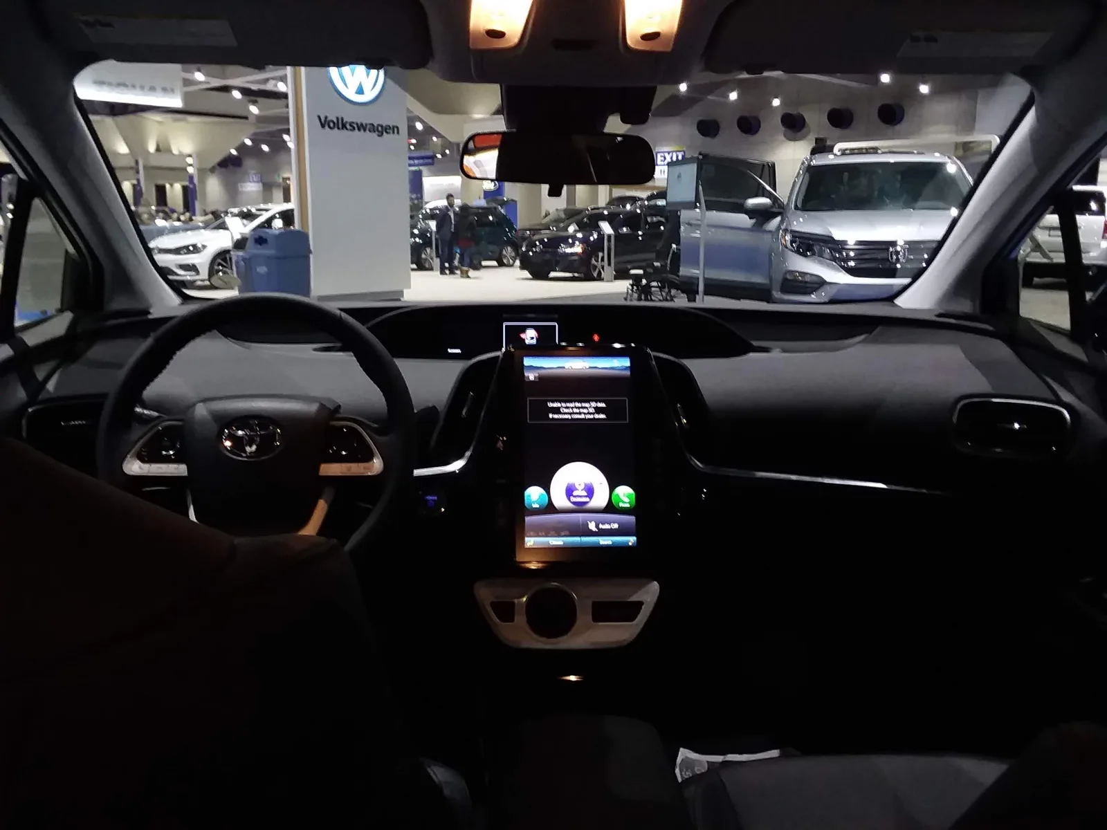The dashboard and cabin inside a Toyota Prius, the interior you level for a car camping mattress