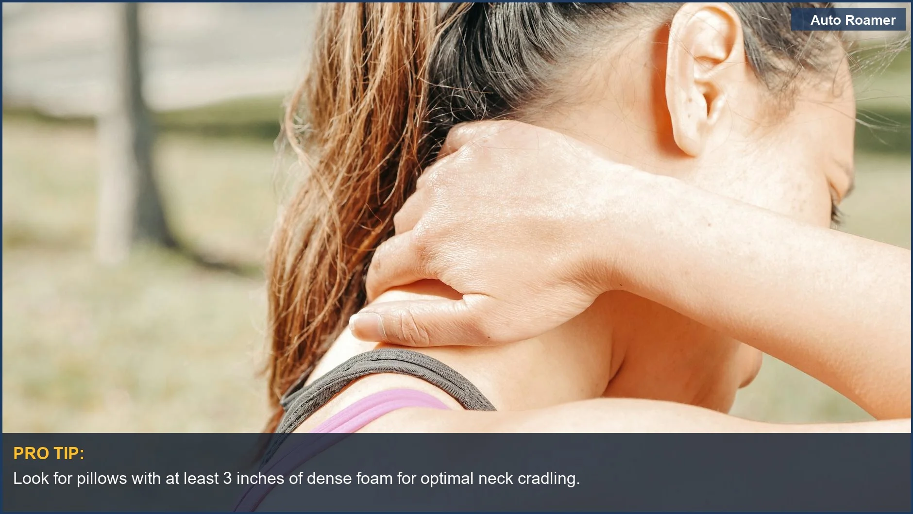Woman massaging her neck to relieve tension, highlighting the need for good car camping pillow neck support.
