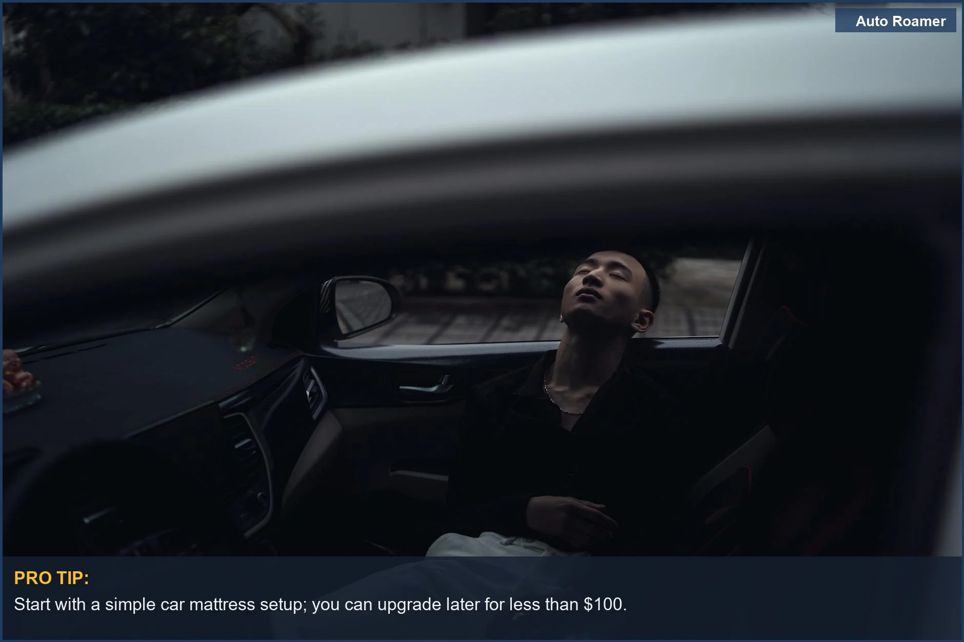 Young man relaxing in a modern car at night, showcasing a budget-friendly car camping sleeping setup.