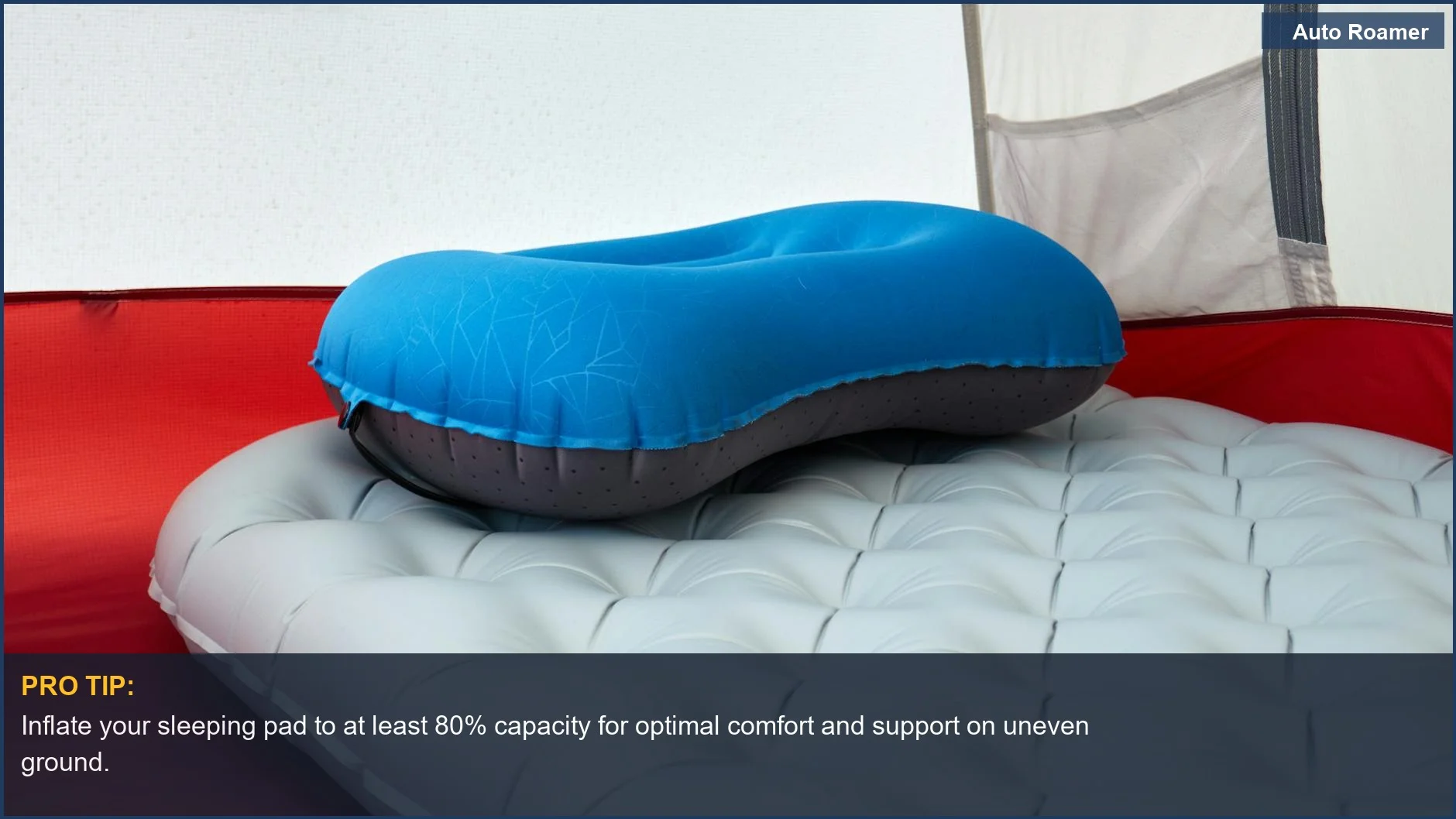Close-up of a comfortable inflatable sleeping pad with a pillow inside a car camping tent.
