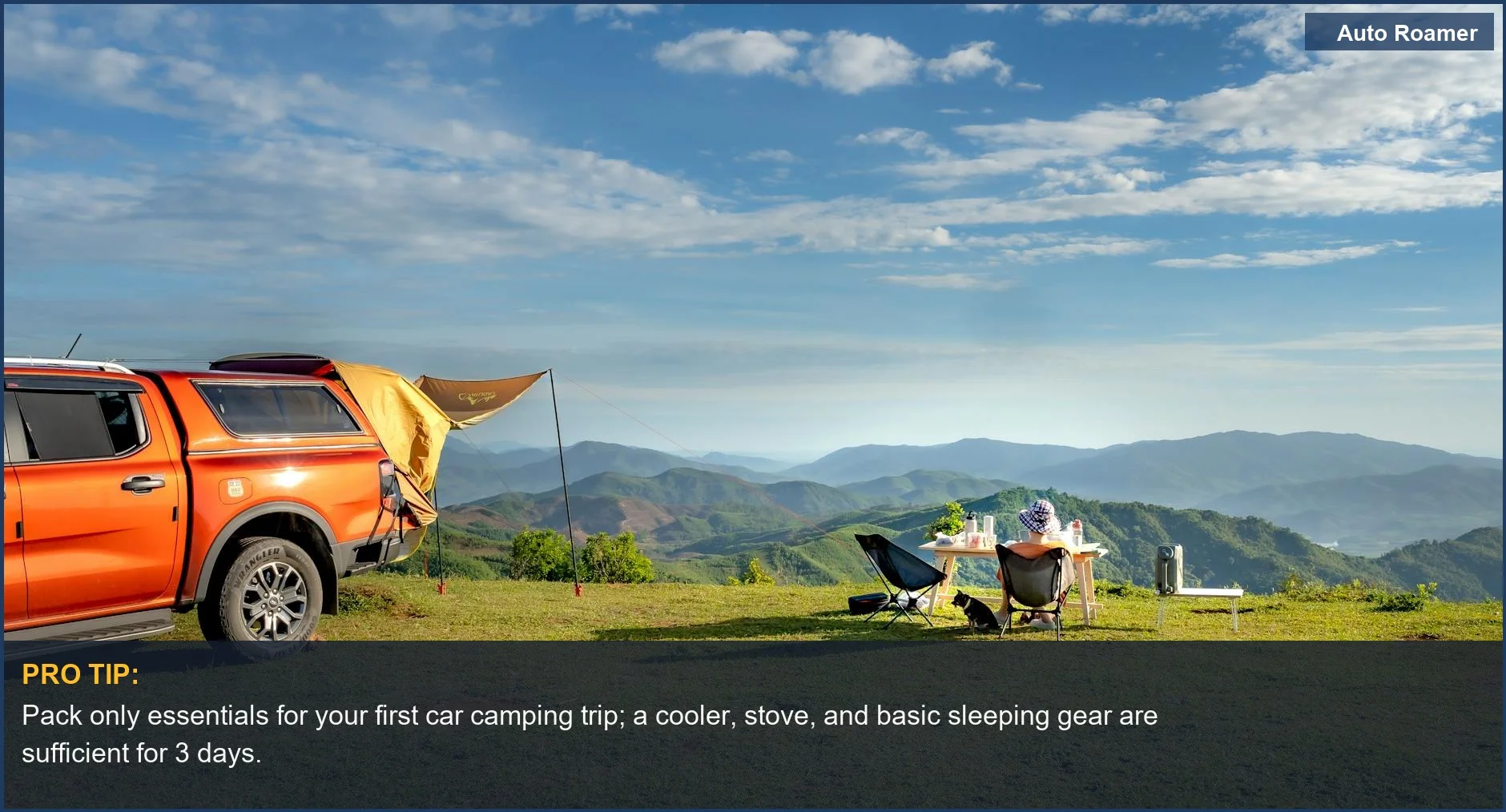 Pickup truck camping setup on hilltop overlooking mountains, ideal for beginner car camping adventures.
