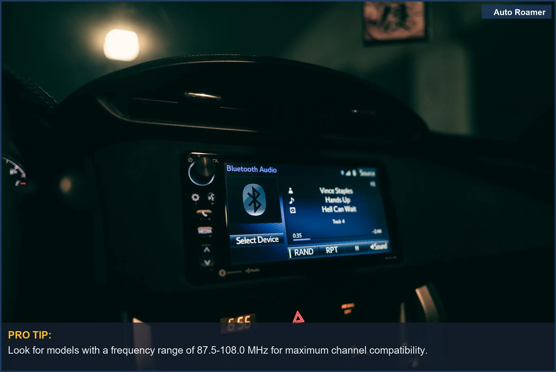 Nighttime view of a car dashboard with a glowing Bluetooth audio system, showcasing a wireless car FM transmitter.