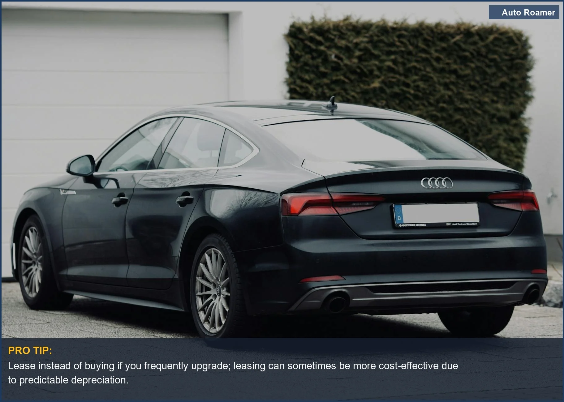 Modern black sedan parked on a suburban street, highlighting car losing value over time.