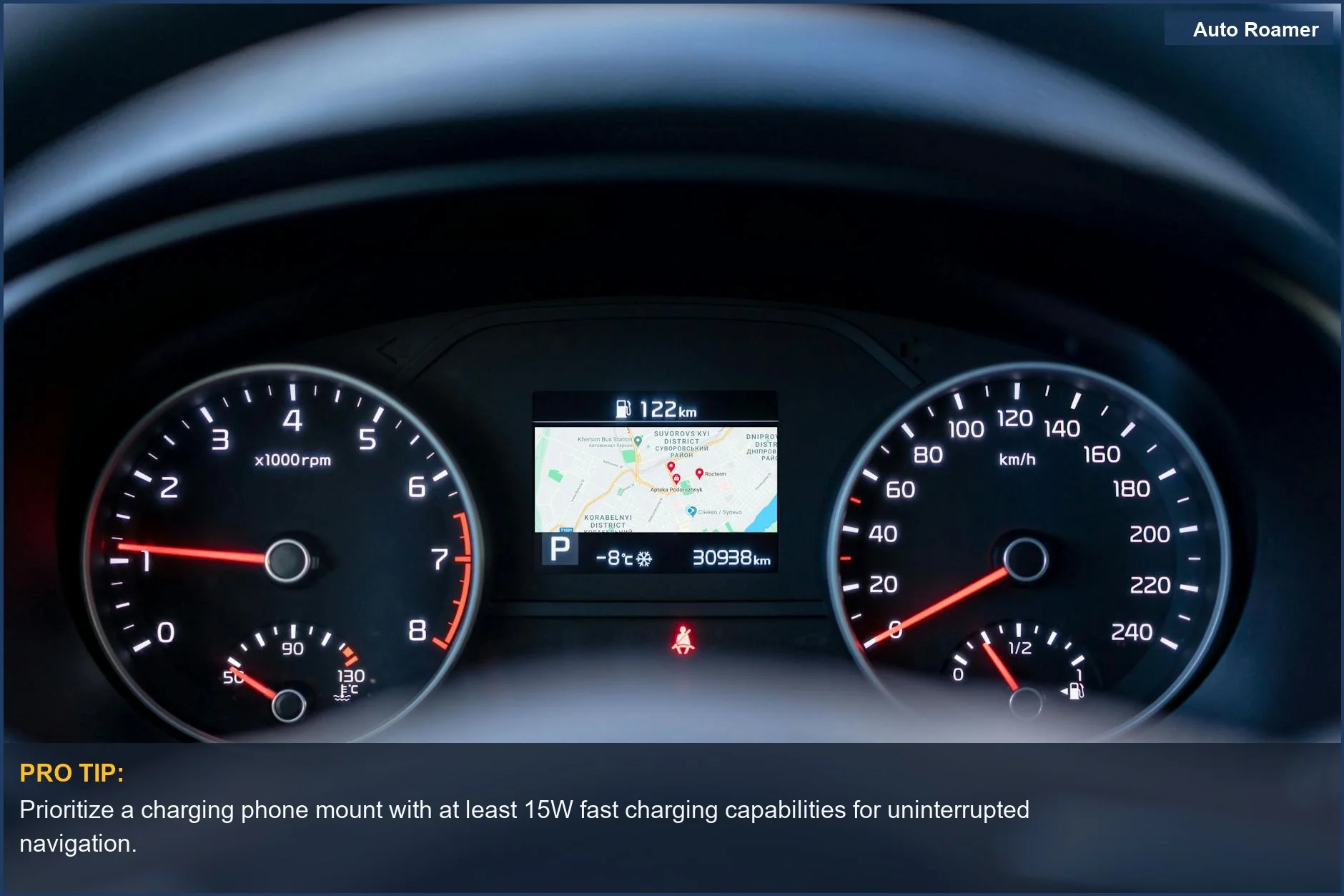 Close-up of a car dashboard with speedometer and GPS display for navigation.