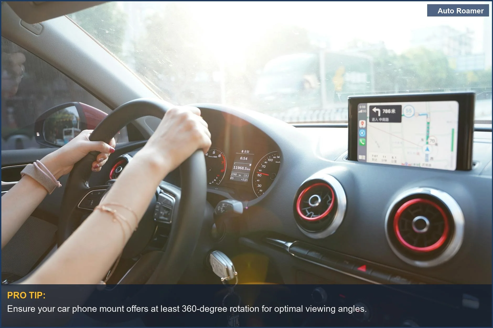 Driver's hands on steering wheel navigating with a phone mount for GPS directions.