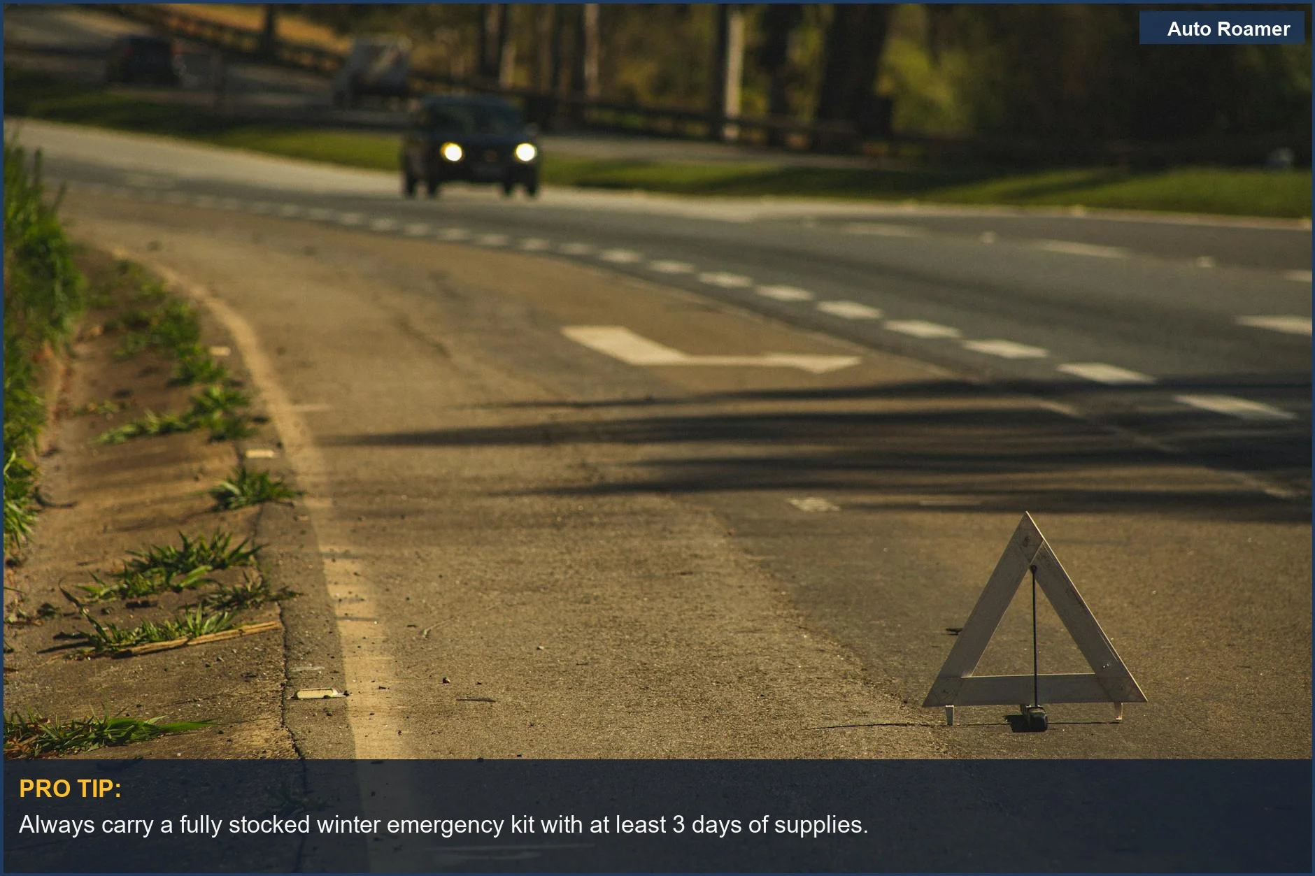 Red roadside emergency triangle placed on a snowy asphalt road for caution.