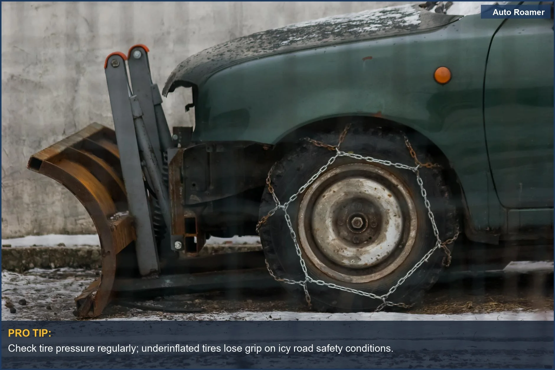 Close-up of a snowplow's tires with chains, ready to clear icy roads.