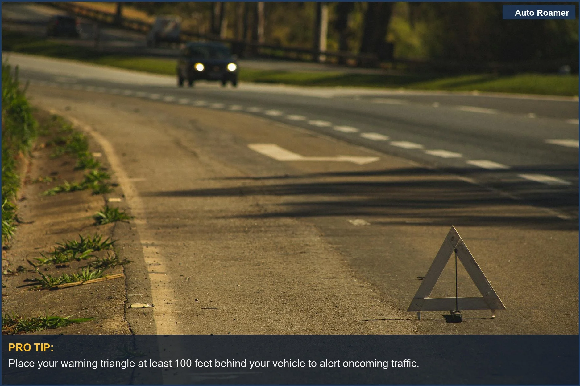 Red emergency triangle on an empty road, signaling road trip safety precautions.