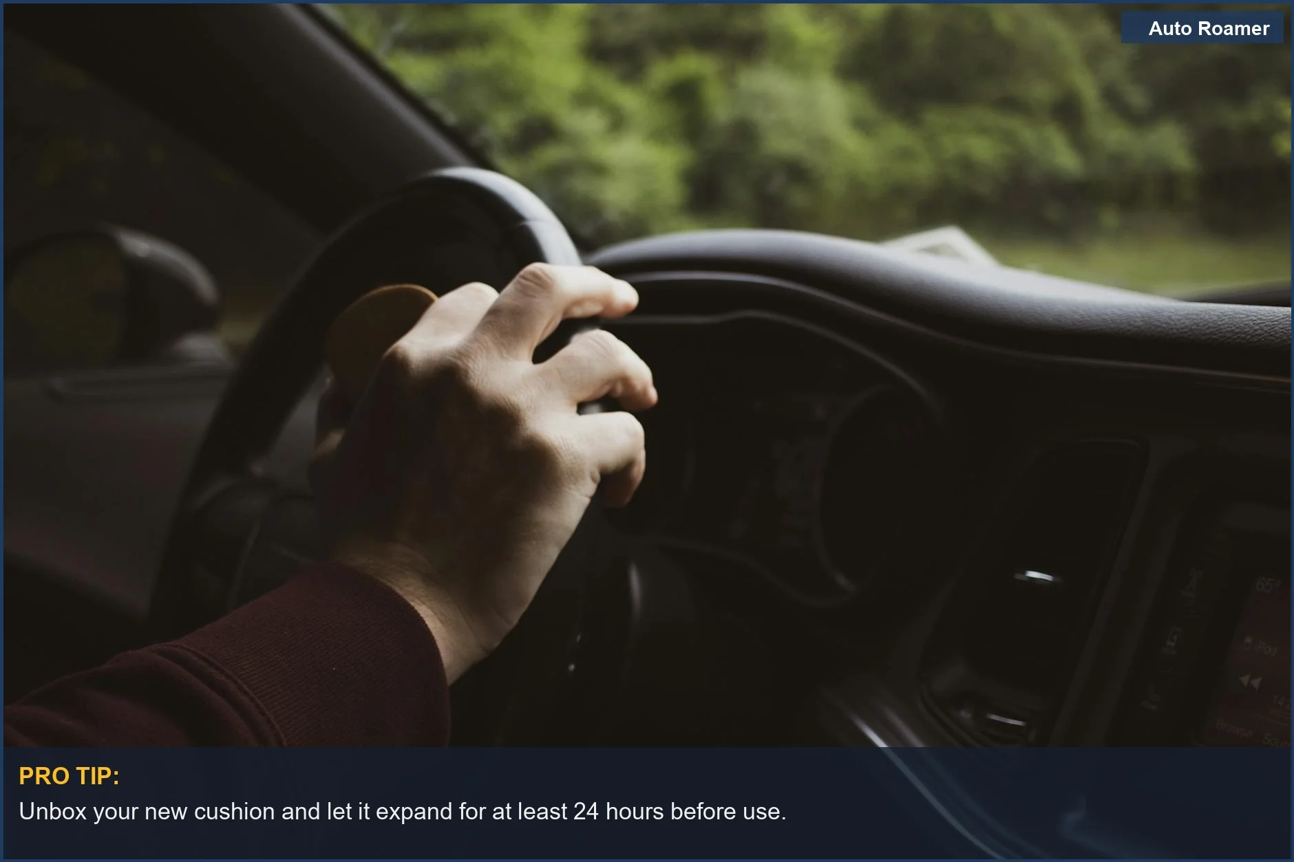 Relaxed hand on car steering wheel, emphasizing the benefit of a comfortable driving position.