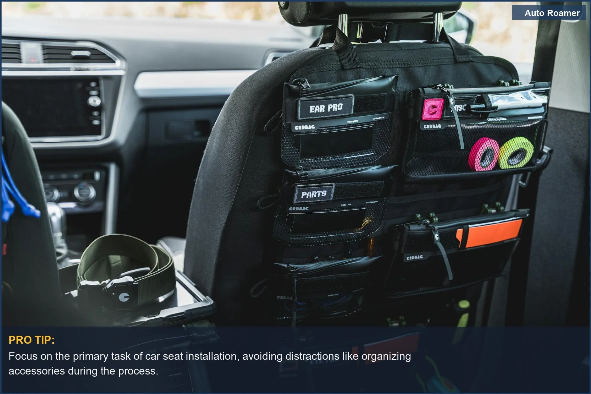 Car seat back organizer, showing gear storage and suggesting potential distractions during car seat setup.