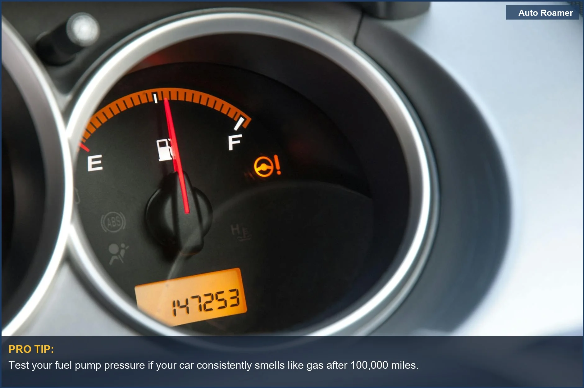 Close-up of a car's fuel gauge and odometer, indicating mileage and potential wear on fuel components.