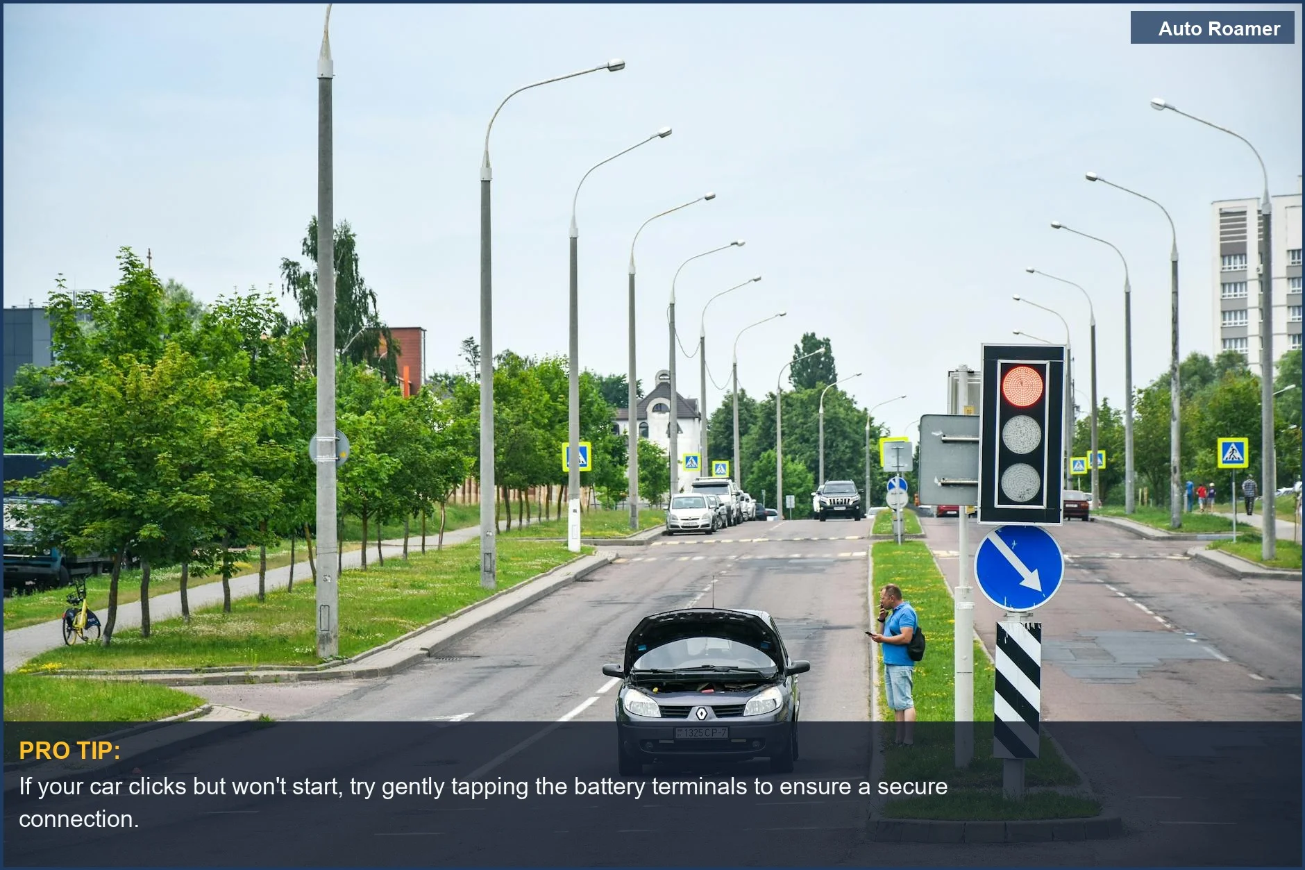 Man stranded with a clicking car won't start, looking stressed while checking his phone on a city street.
