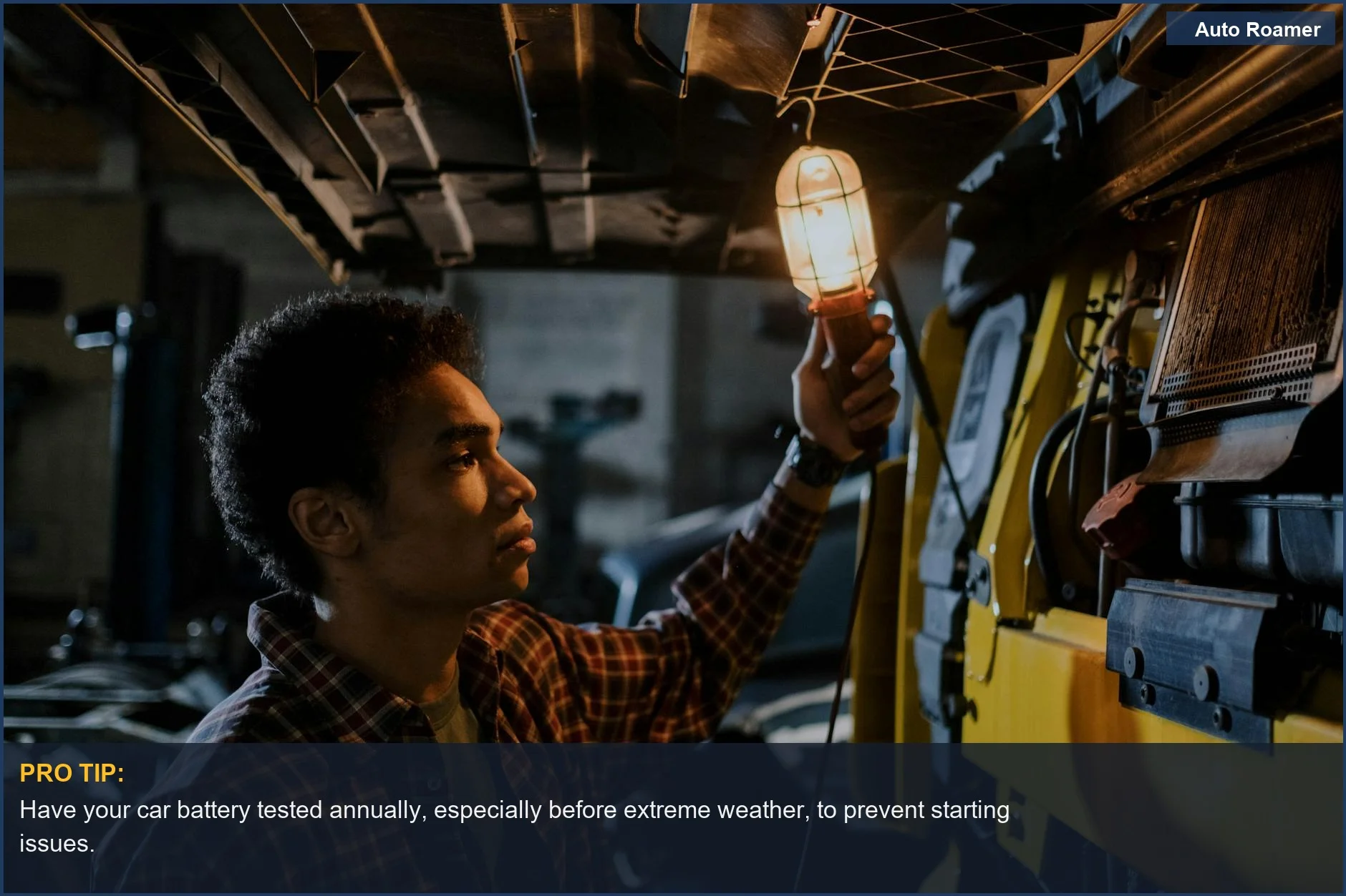 Auto mechanic uses a trouble light to inspect a truck engine, diagnosing a car that won't start with clicking.