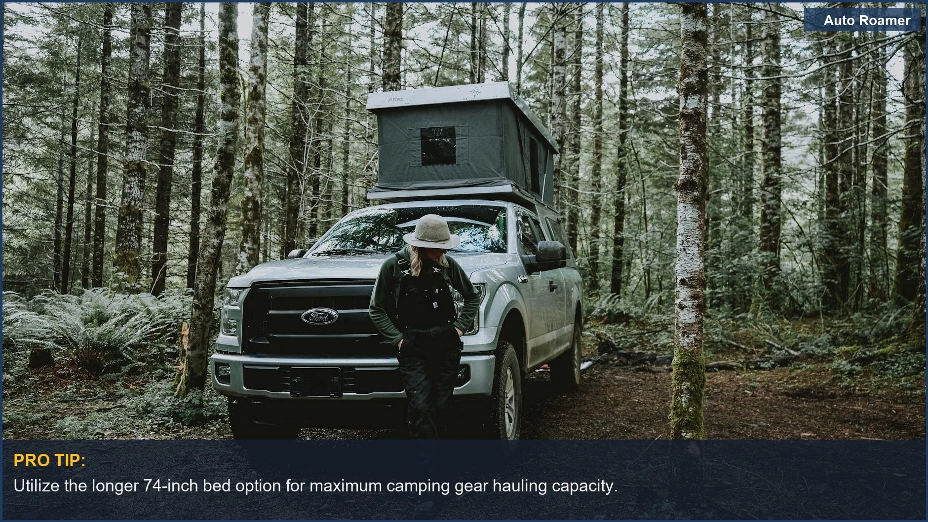 Woman camping with a tent on a Chevrolet Colorado pickup truck in Oregon woods.