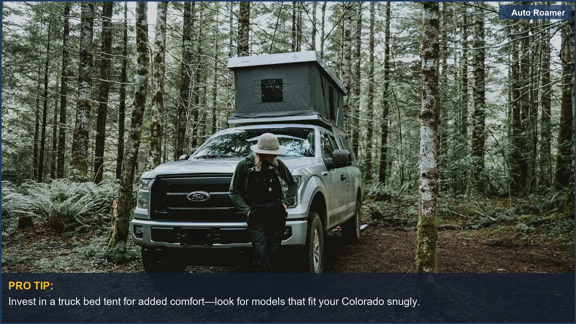 Woman setting up a truck bed tent on a Chevy Colorado in Oregon woods
