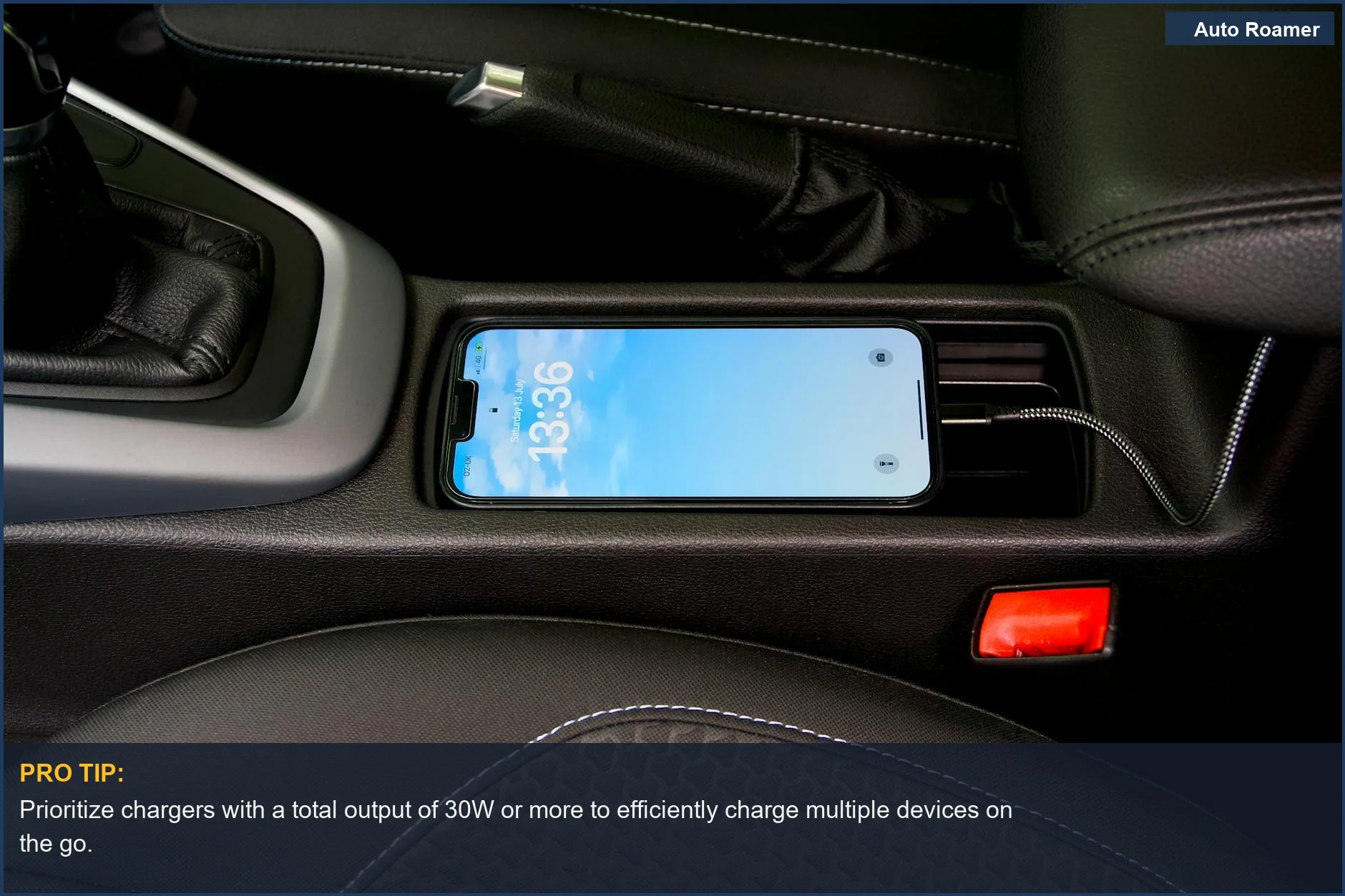 Close-up of a smartphone charging in a car's central console, ideal for modern automotive USB ports.