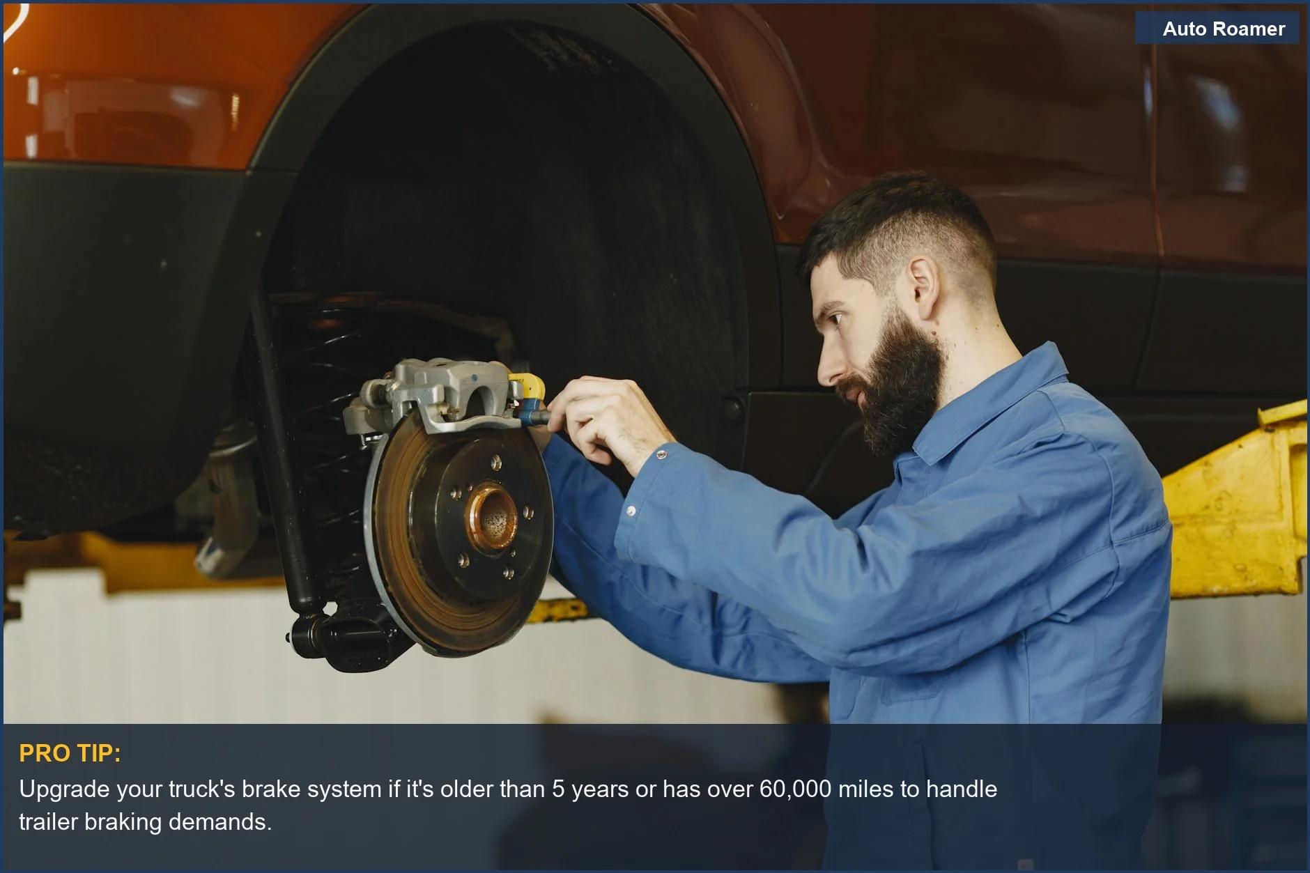 Mechanic inspecting car brakes, emphasizing the need for a brake controller for towing safety.