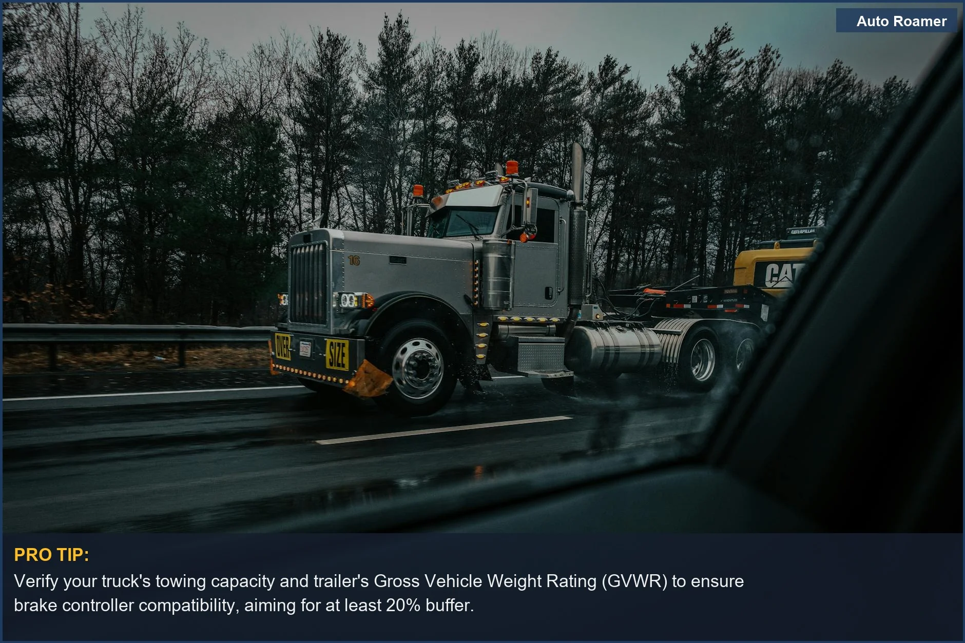 Large truck with oversize load on rainy highway, showing importance of brake controller compatibility.