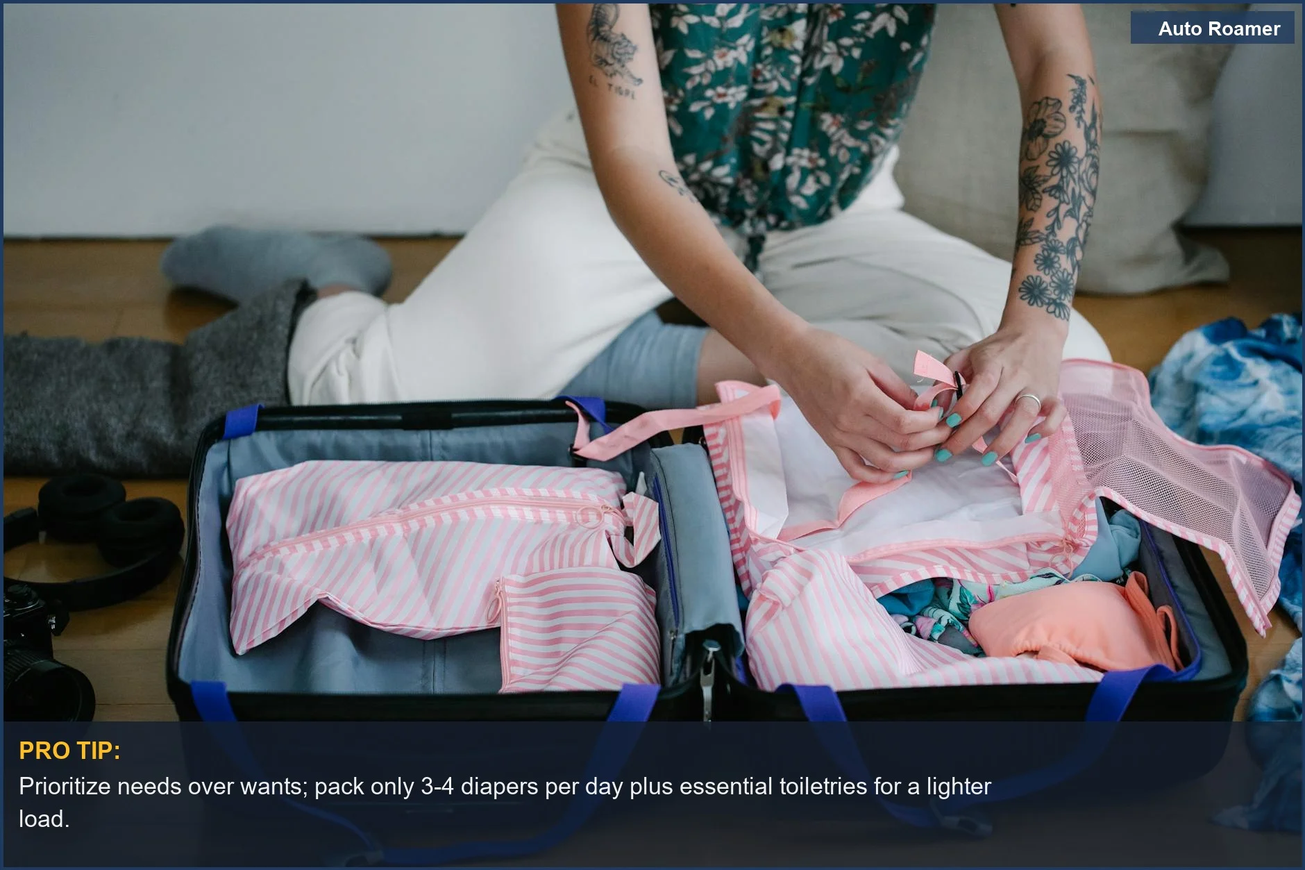 Woman thoughtfully packing a travel suitcase indoors, preparing for a trip with her baby.