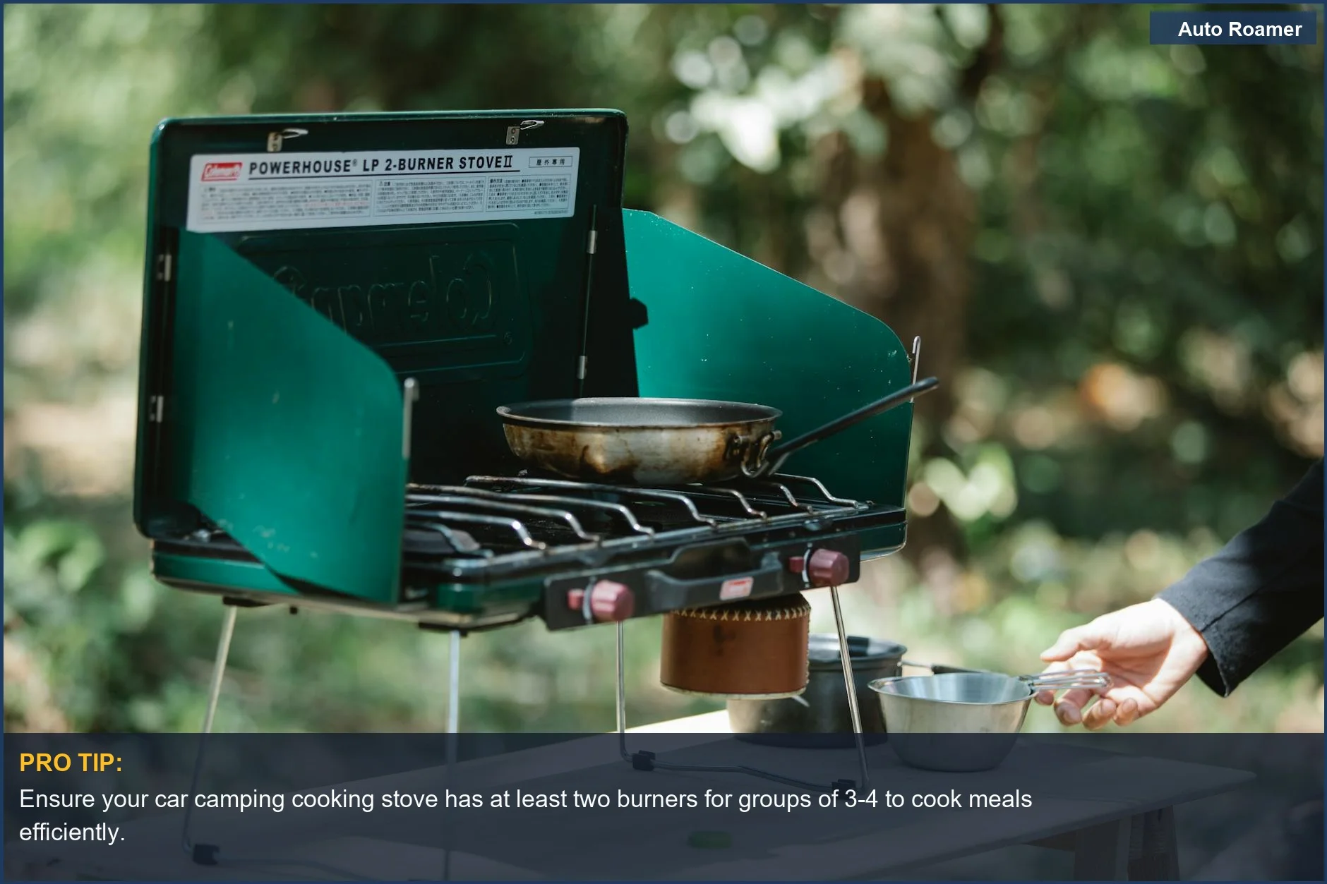 Portable gas camping stove with cooking pan, highlighting the importance of adequate stove burner count for groups.